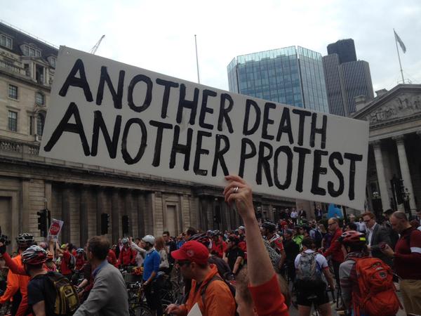 A demonstrator holds a banner at the protest