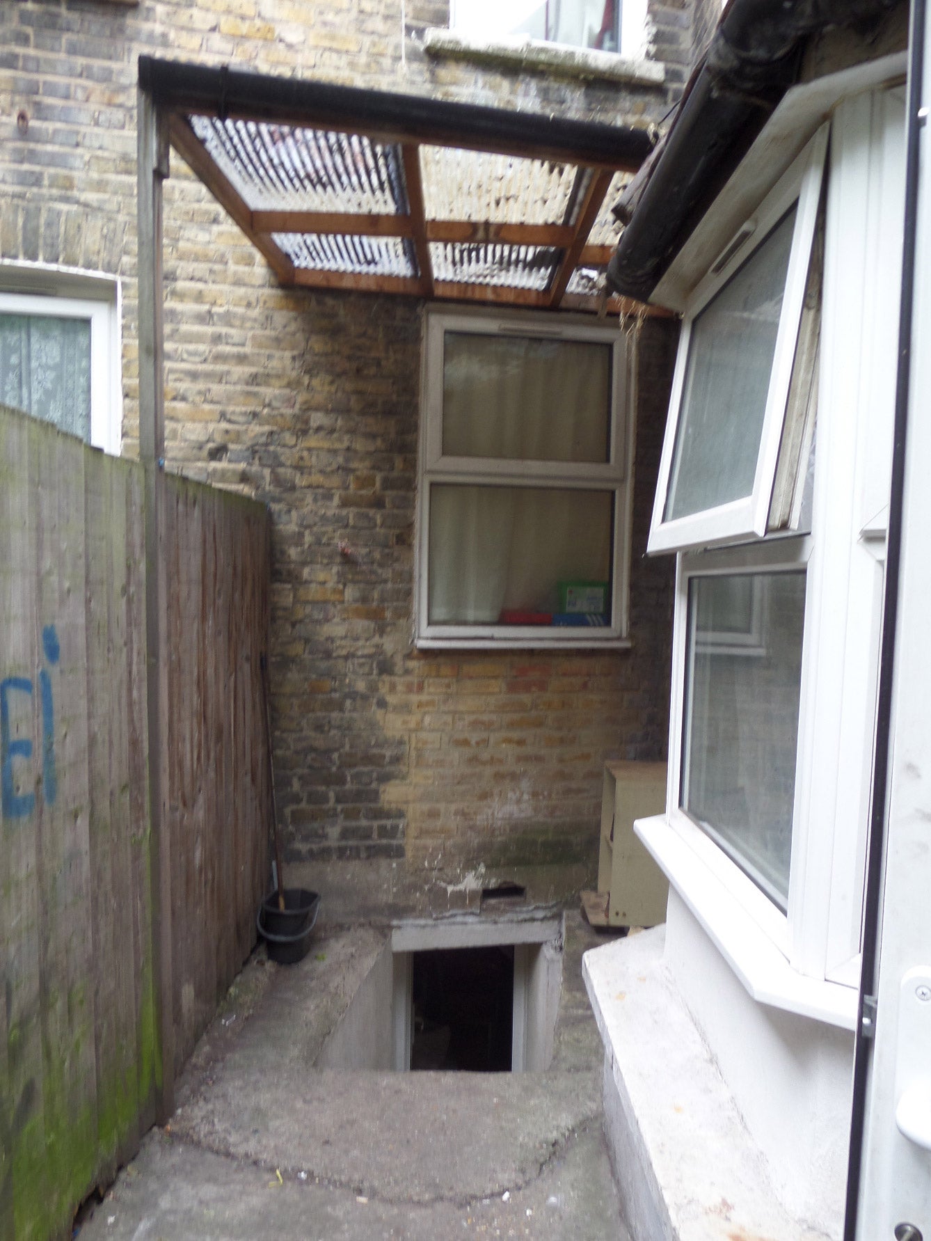 Only entrance to the basement where seven people are sharing five beds