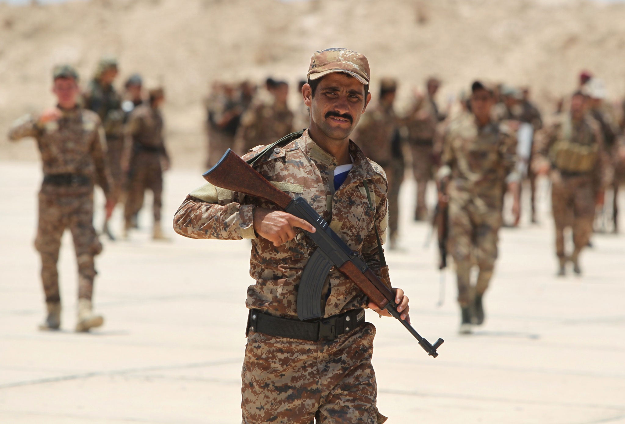 Iraqi Sunni volunteers from the Anbar province, who joined Iraq's Popular Mobilisation force to fight against Isis (Getty)