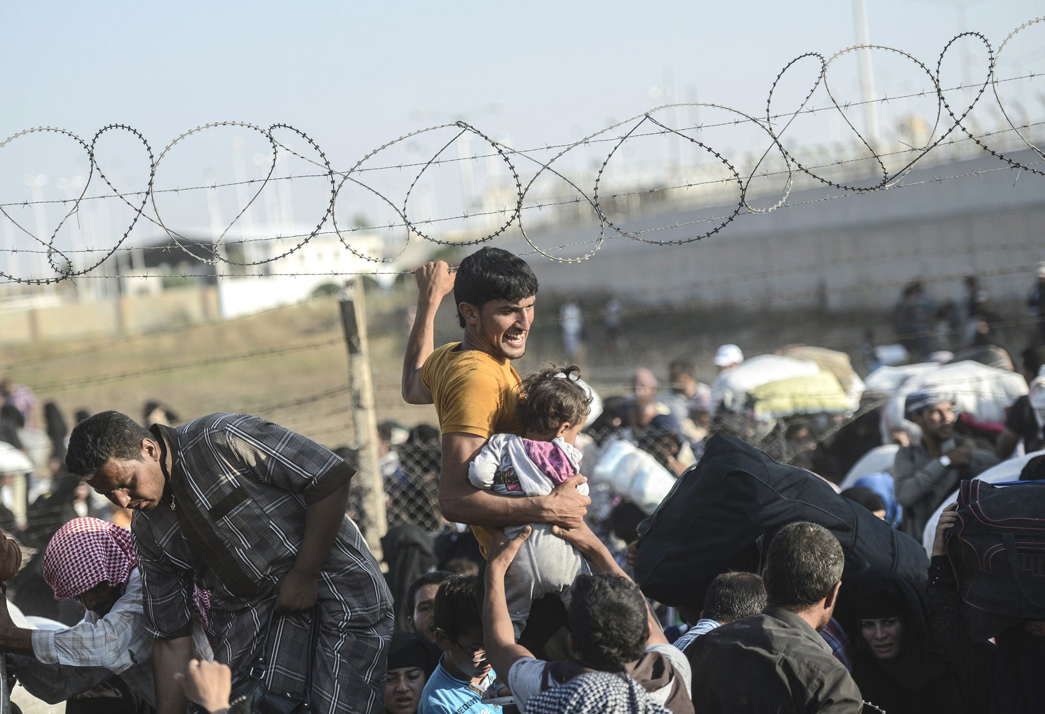 Syrian refugees flee the war between Kurds and Islamic State (Getty)