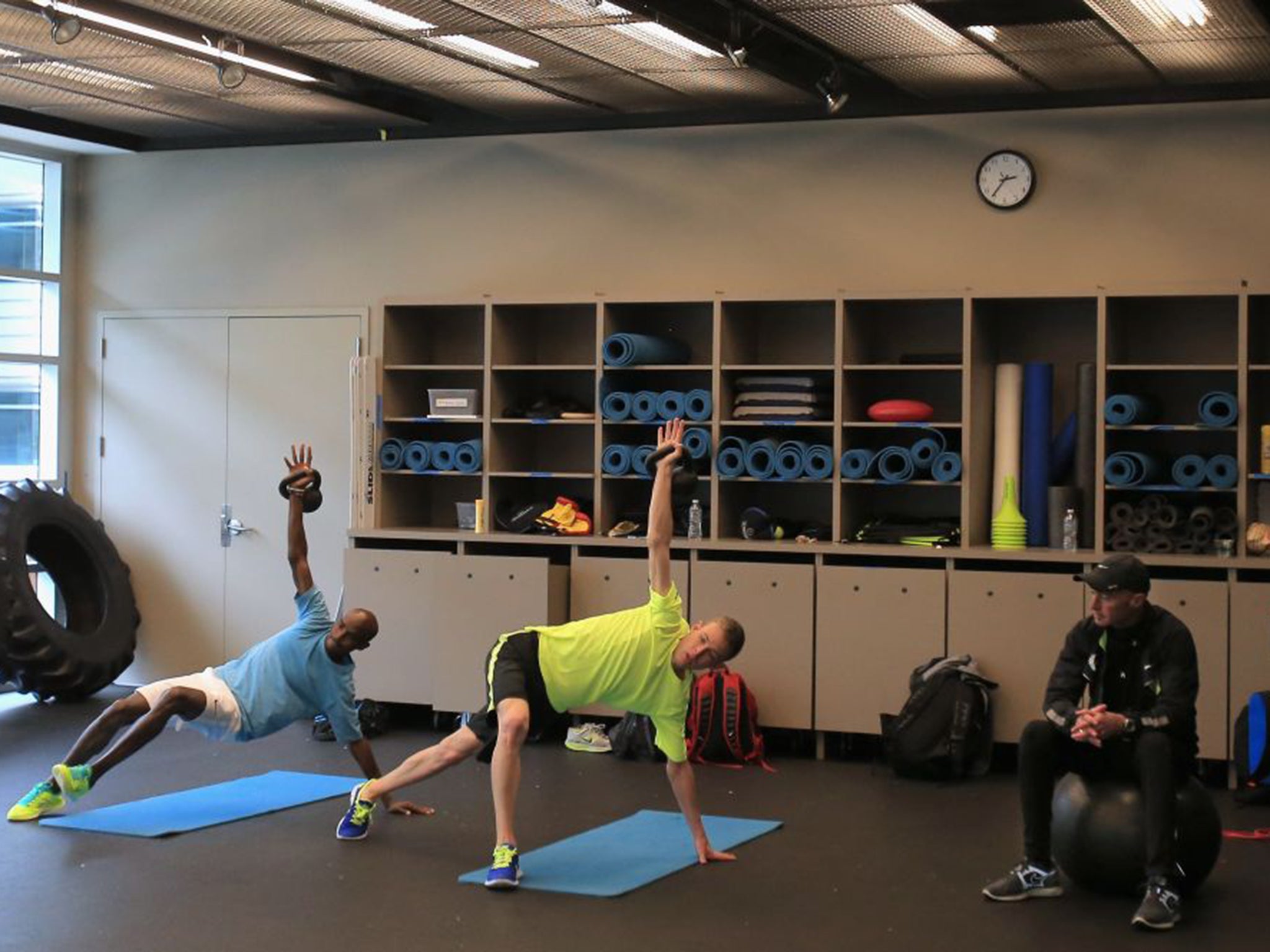 Alberto Salazar, with cap, overseas Mo Farah, left, and Galen Rupp during training at the Oregon Project back in 2013