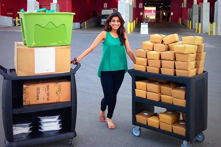 Ms Ahmad with some of the surplus food she's helped give to the homeless