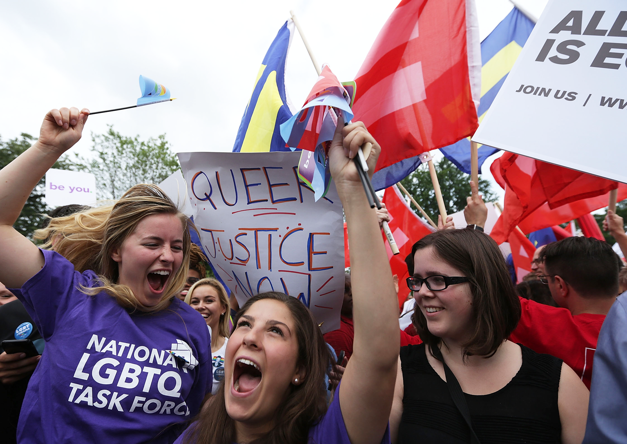 Same-sex marriage supporters celebrate the Supreme Court's decision while civilisation crumbles beneath their very feet