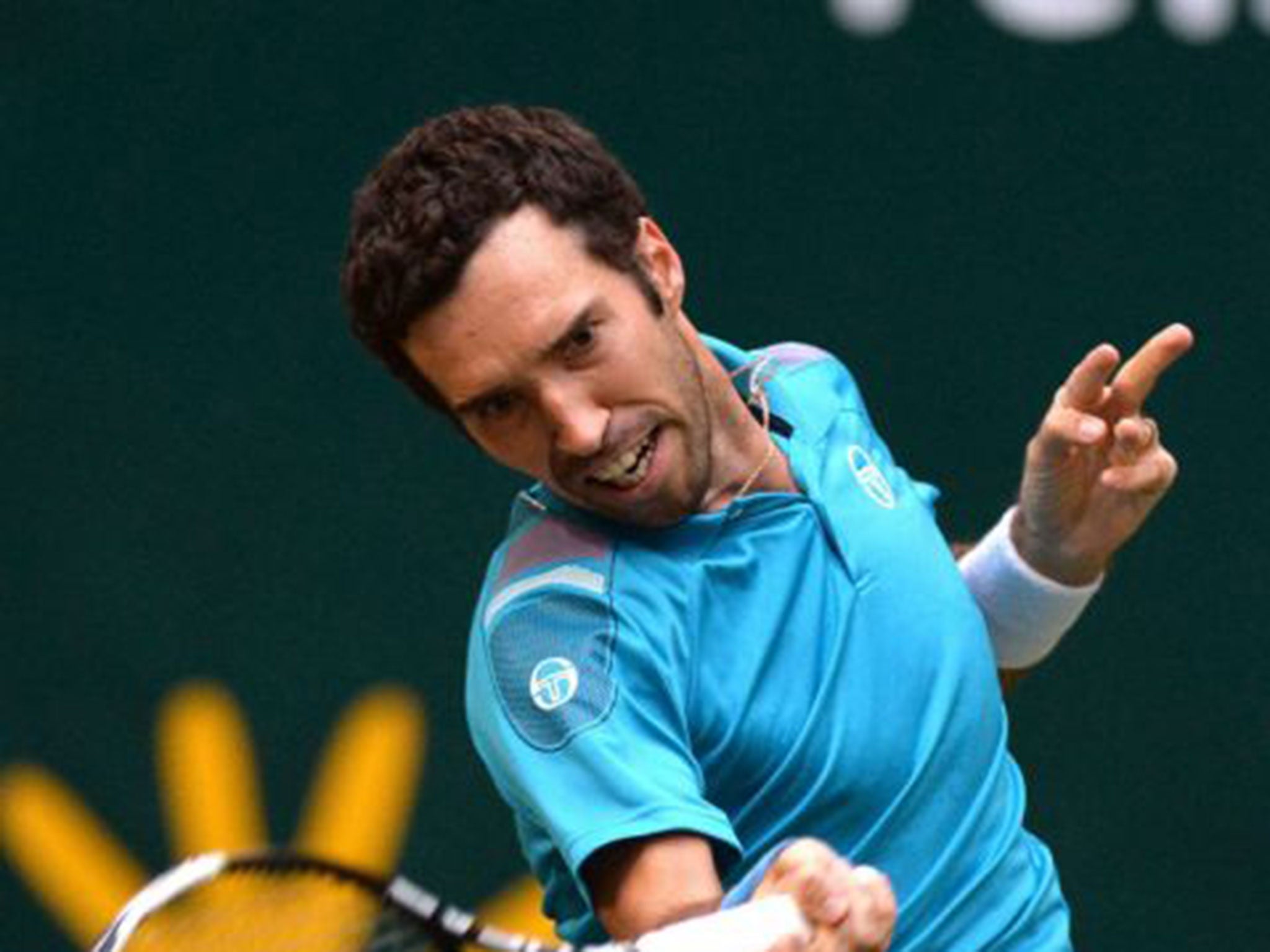 Mikhail Kukushkin of Kazakhstan in action against Gael Monfils