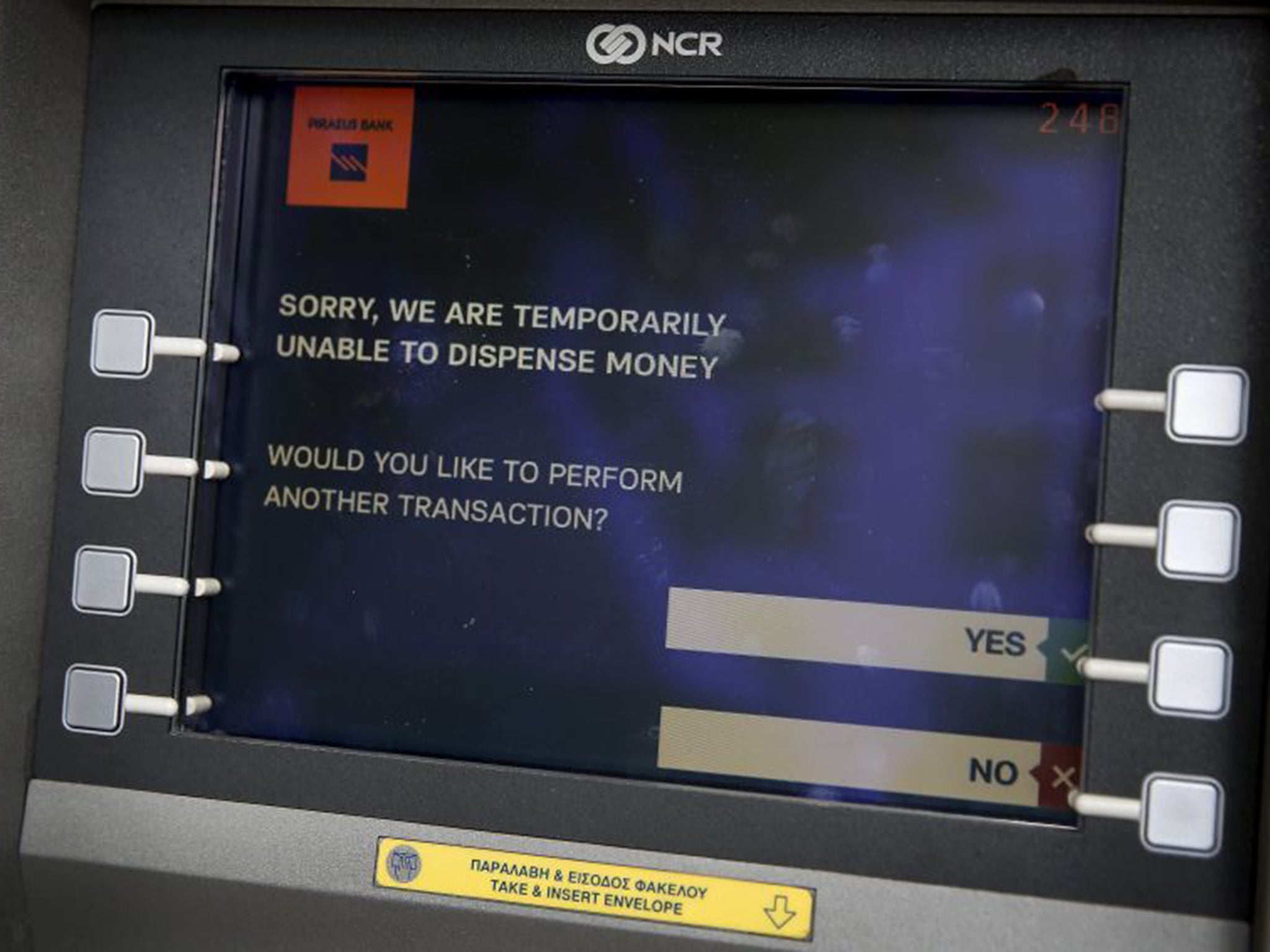 The message displayed on the monitor of a Piraeus Bank ATM in Athens. The Bank of Greece has recommended imposing restrictions on bank withdrawals