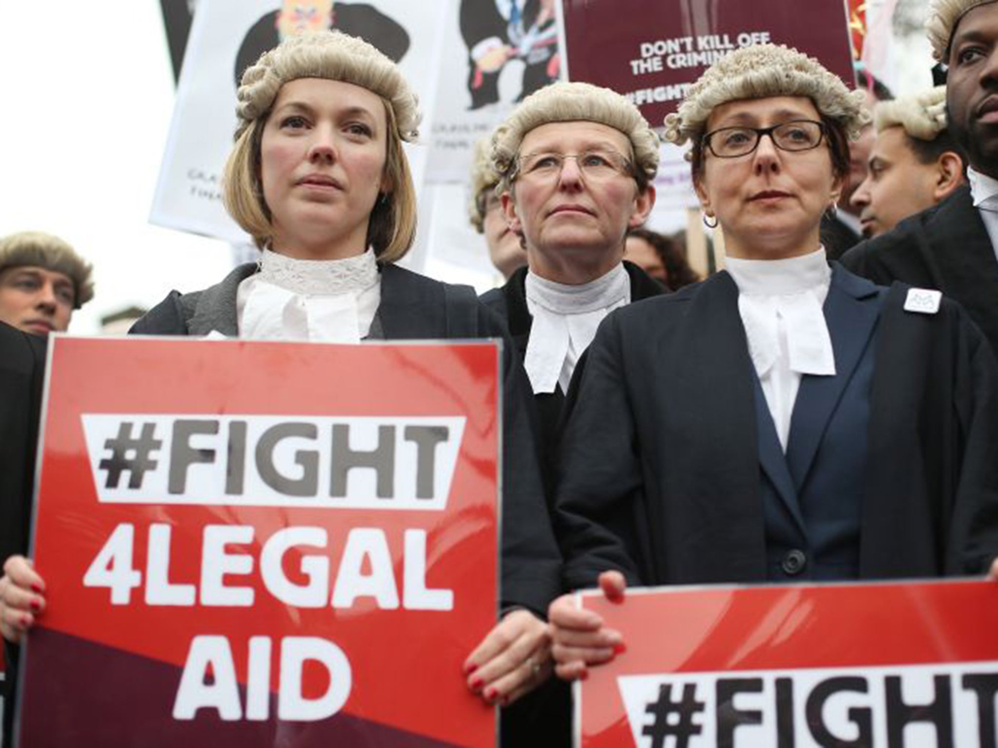 Barristers and solicitors demonstrate against proposed cuts to legal aid fees in March 2014