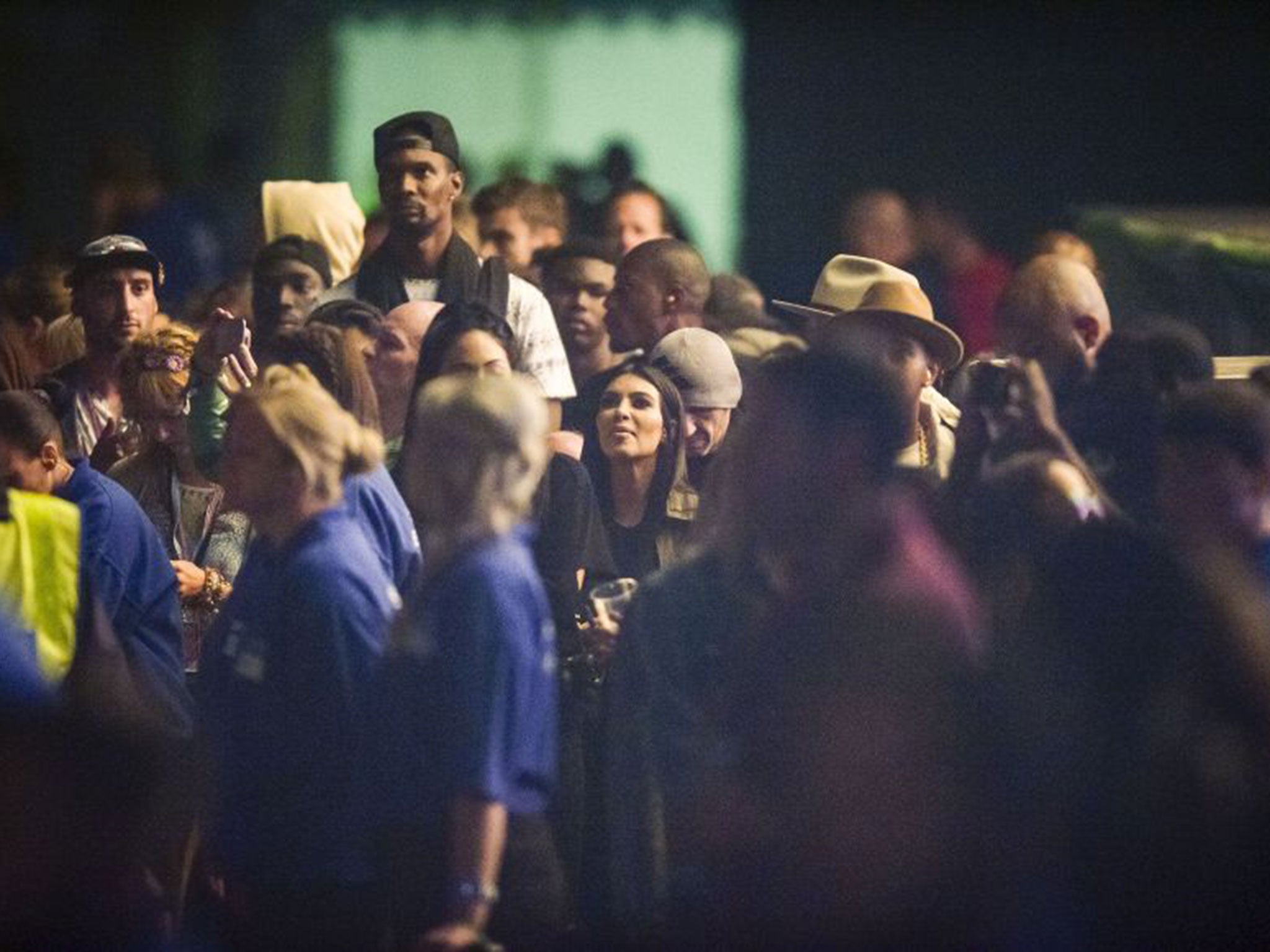 Kim Kardashian watches her husband Kanye West performing on the Pyramid Stage