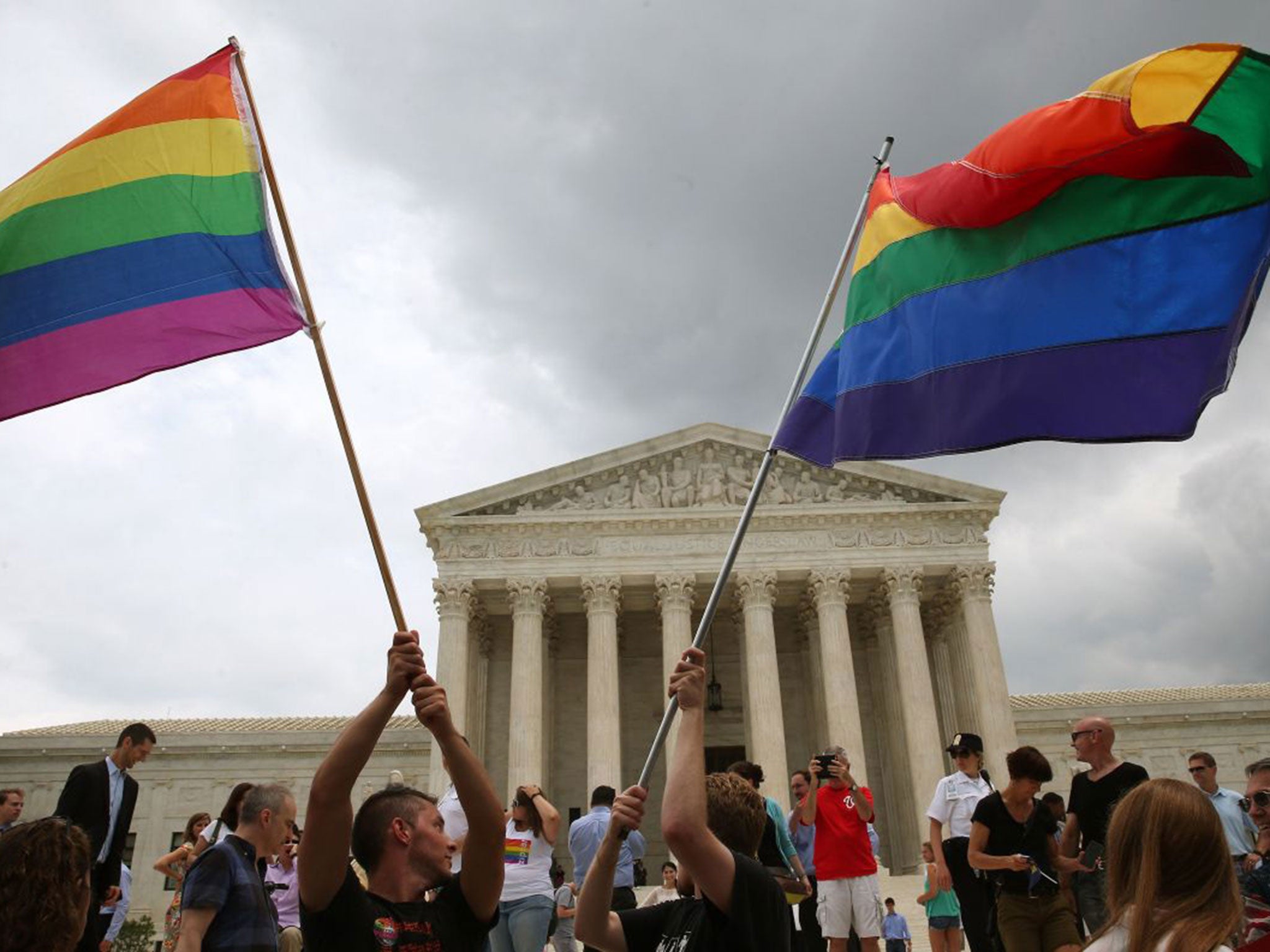 People celebrate in front of the US Supreme Court after the ruling in favour of same-sex marriage June 26, 2015 in Washington, DC