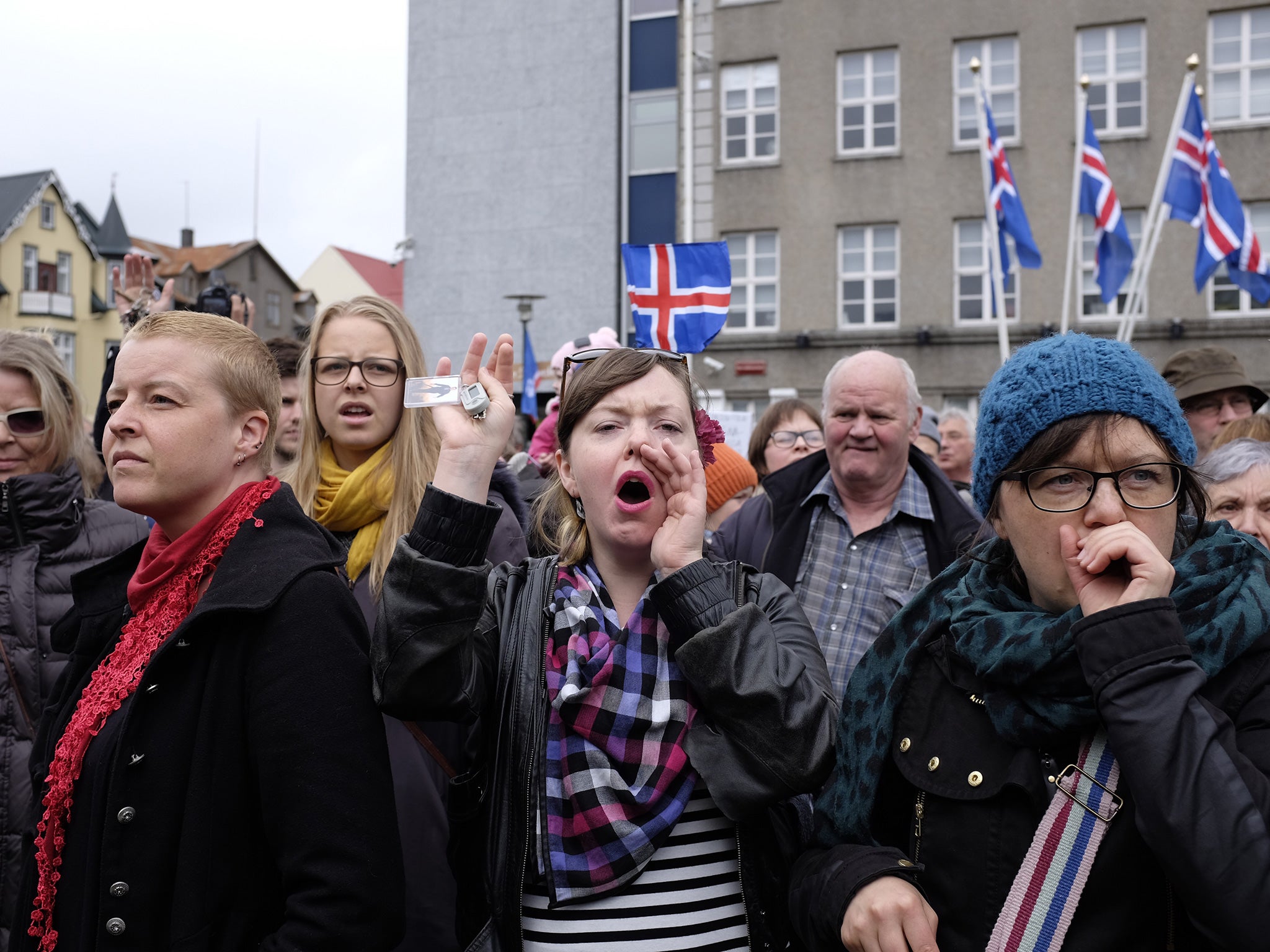 Protesters gathered outside parliament during National Day celebrations on 15 June