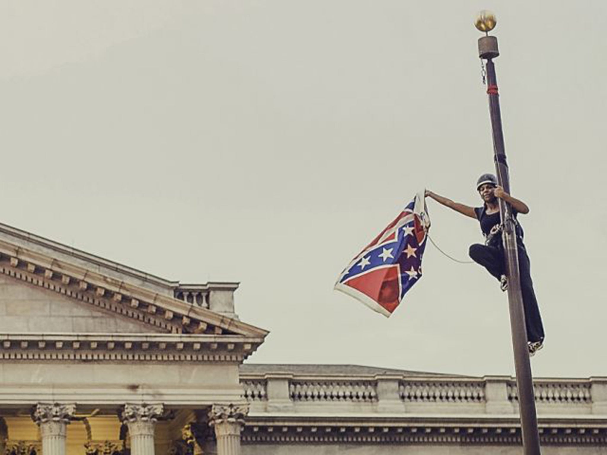 Bree Newsome, a teacher and activist, scaled the 30ft pole in front of the State House and detached the flag