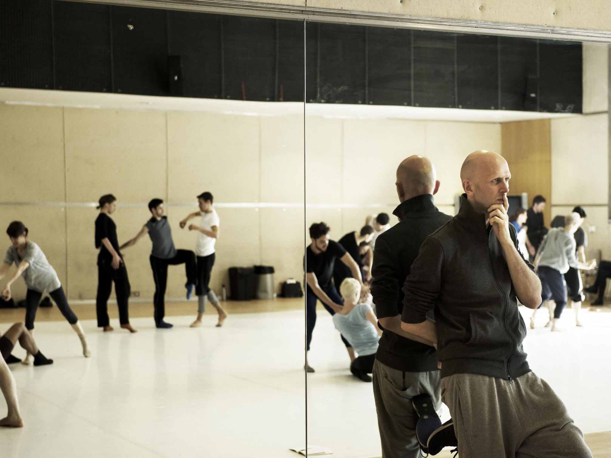 Time to reflect: a rehearsal for 'Tree of Codes', directed by Wayne McGregor (right)