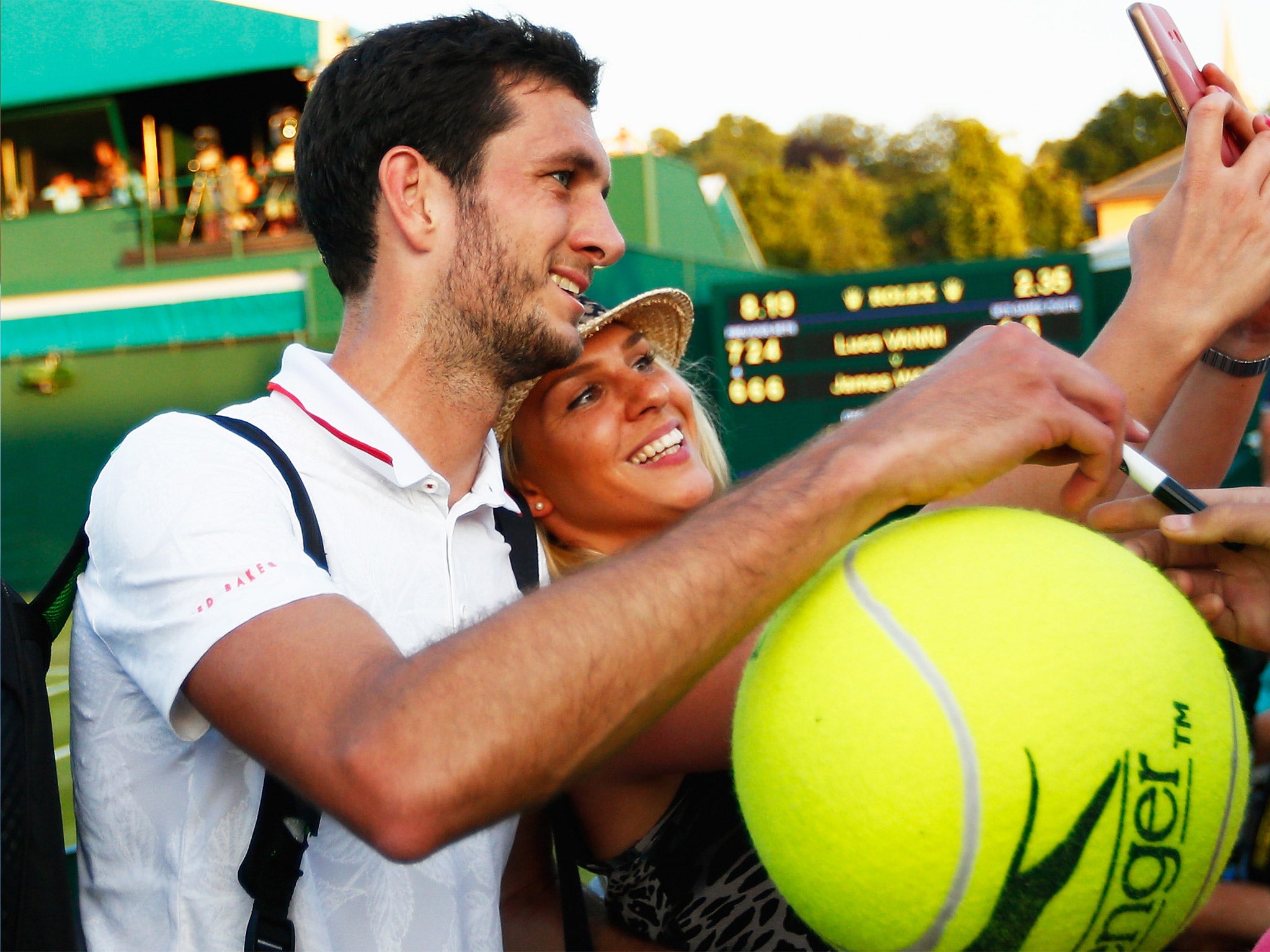 Jamie Ward poses for a selfie with a fan following victory at Wimbledon on Tuesday