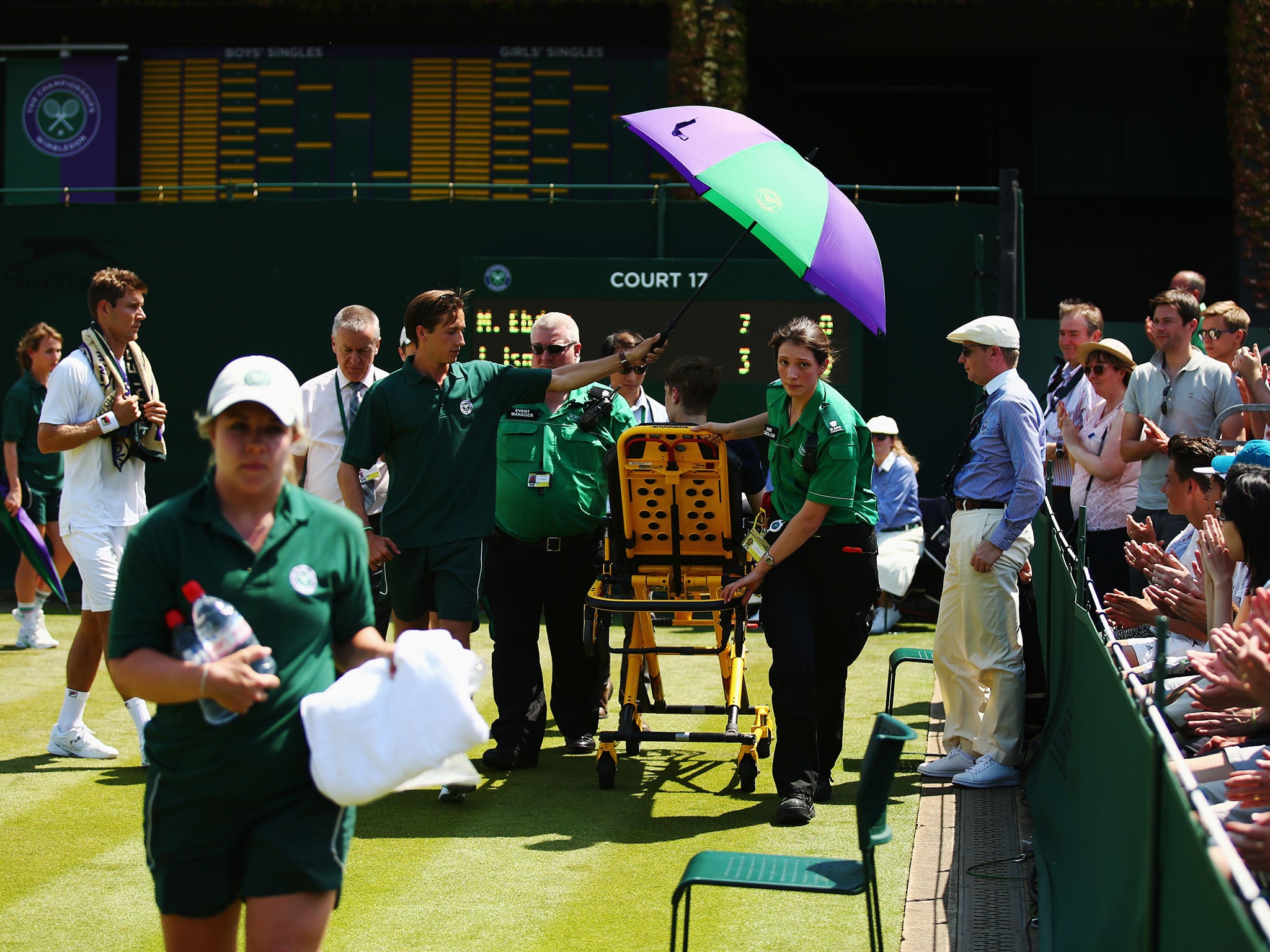 The ball boy receives treatment at Wimbeldon