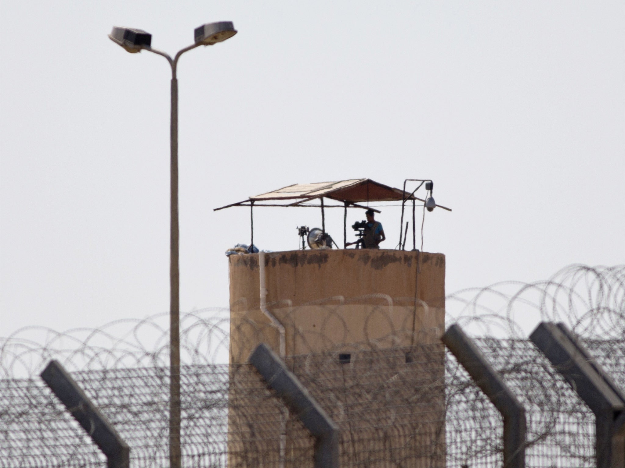 An Egyptian soldier watches from a post in Egypt's northern Sinai province