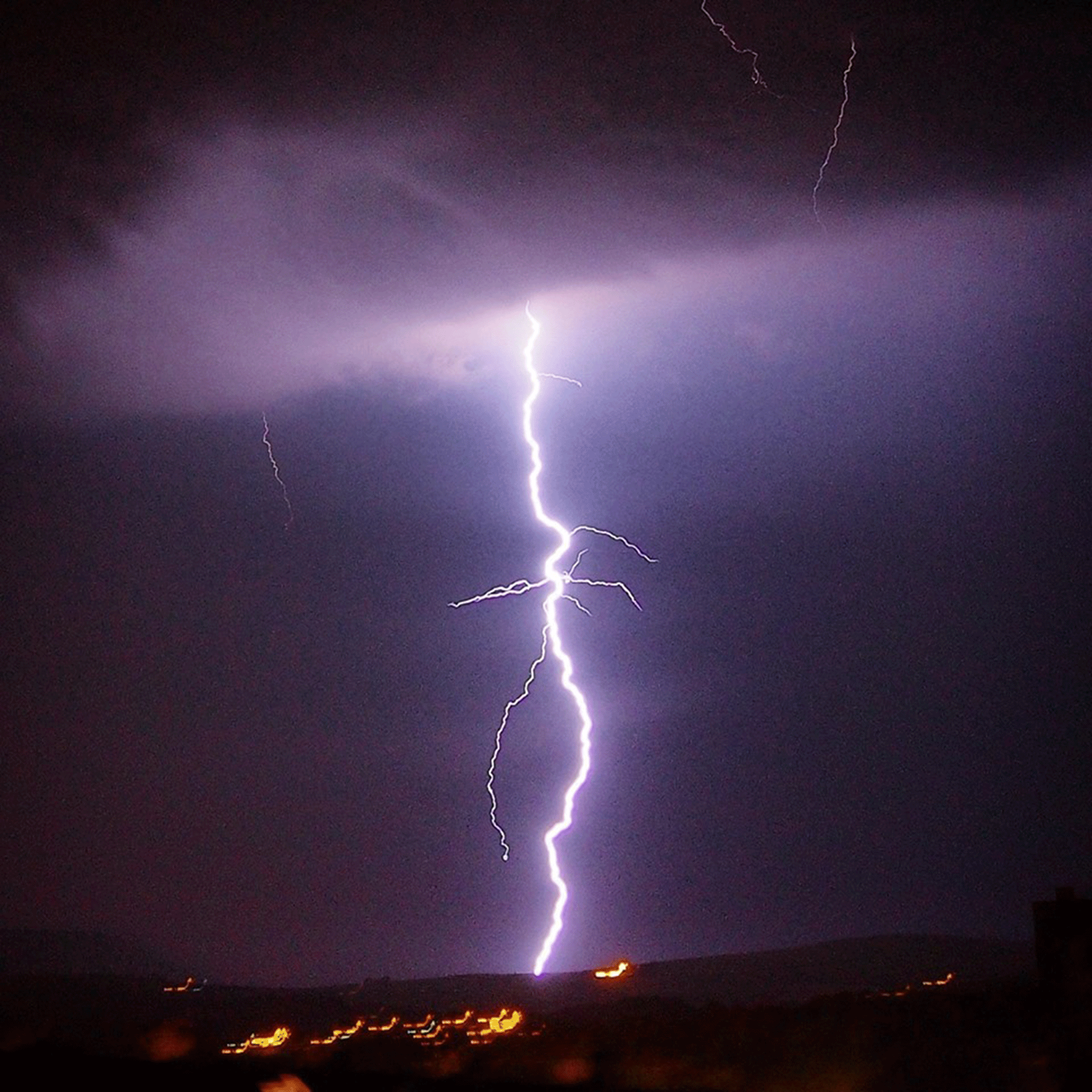 A lightning strike captured in Colne, Lancashire, looking towards Pendle Hill by Patrick Rimdzevicius as storms hit northern parts of England on 1 July