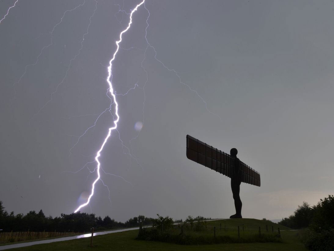 Lightning over the Angel of the North in a heavy storm as Britain has endured the hottest July day on record