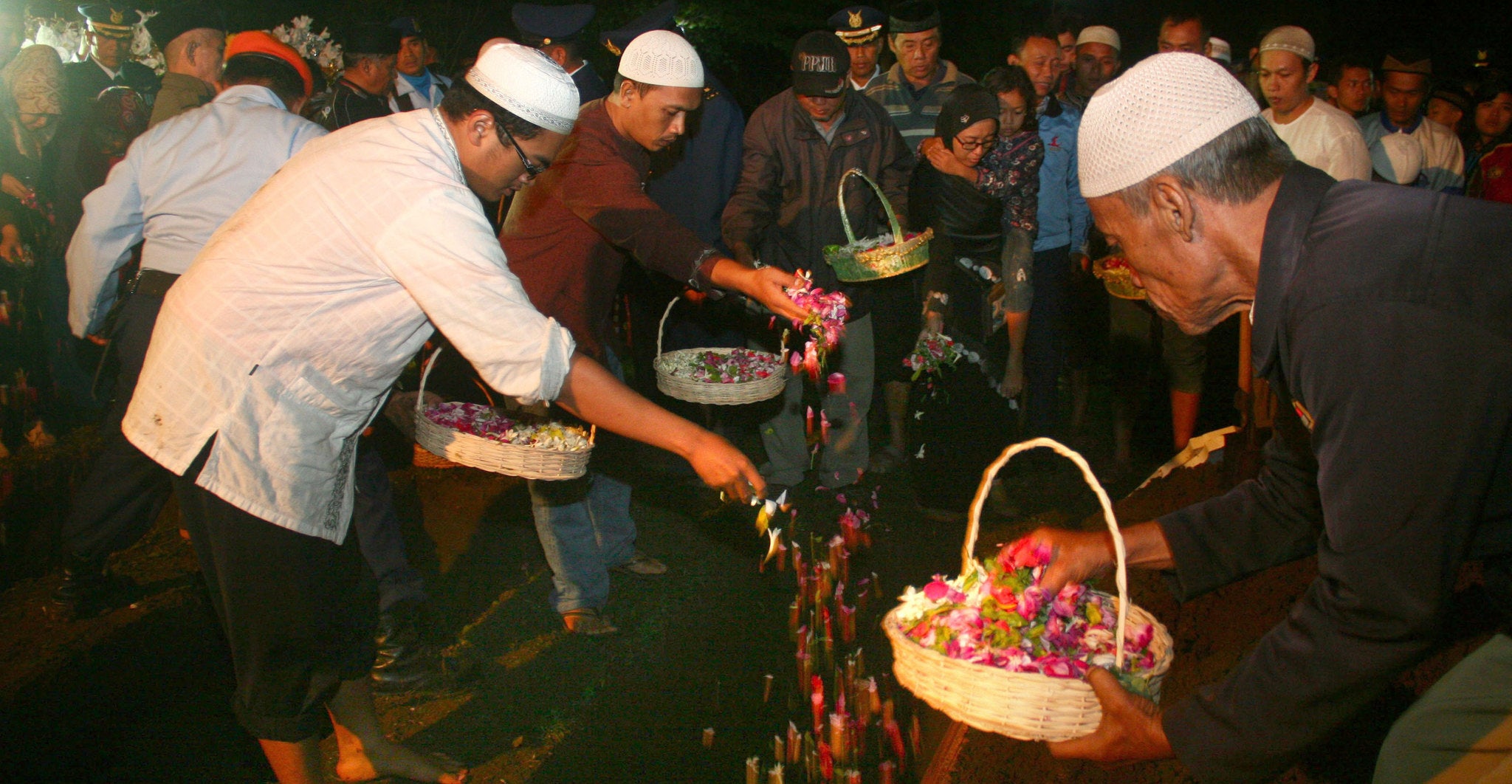 Relatives of soldiers and military officers who were killed in the Indonesian Air Force C-130 Hercules aircraft crash are buried in a public cemetery