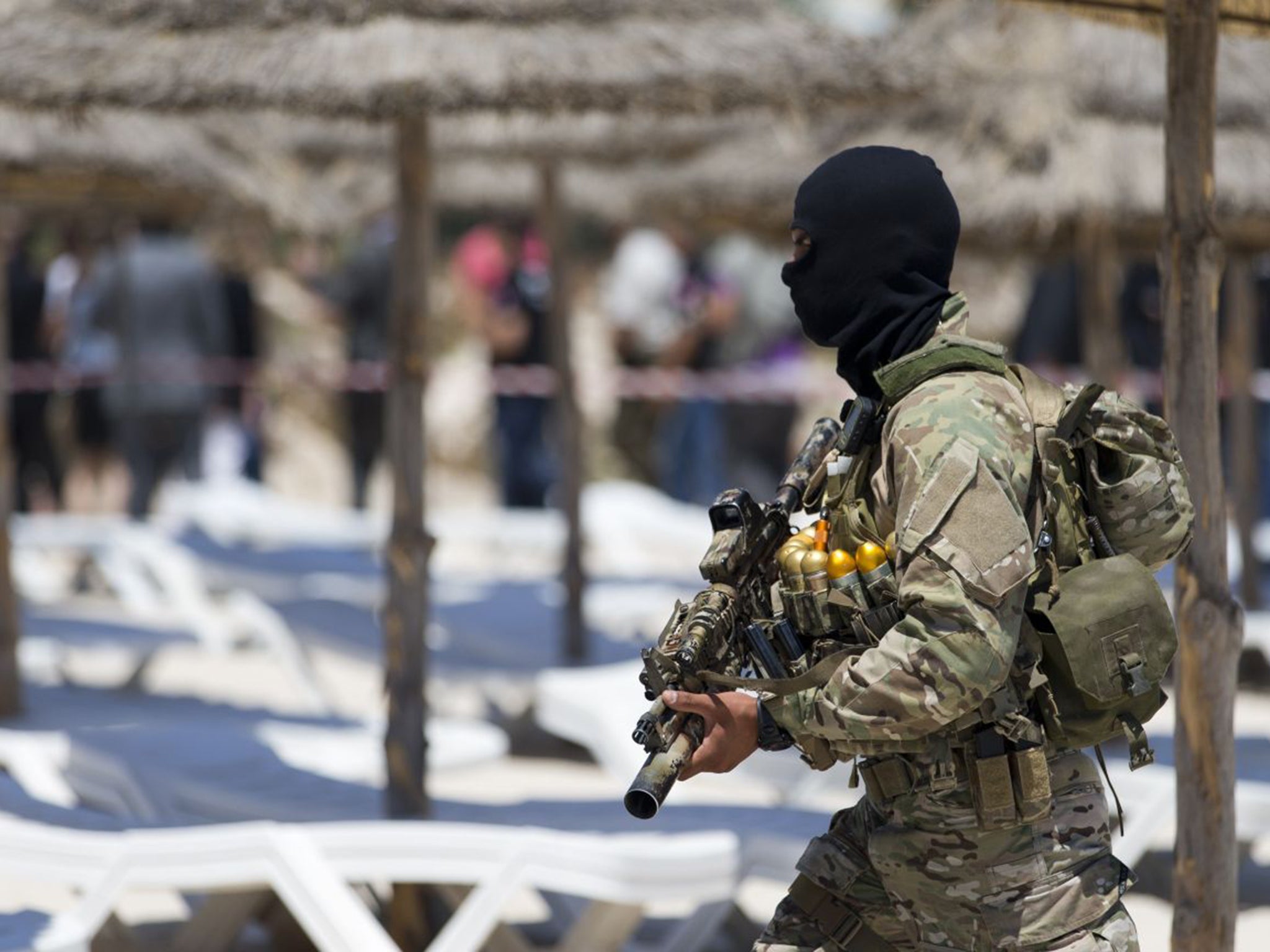 A Tunisian soldier guards the beach at the Riu Imperial Marhaba Hotel in Port el Kantaoui, on the outskirts of Sousse