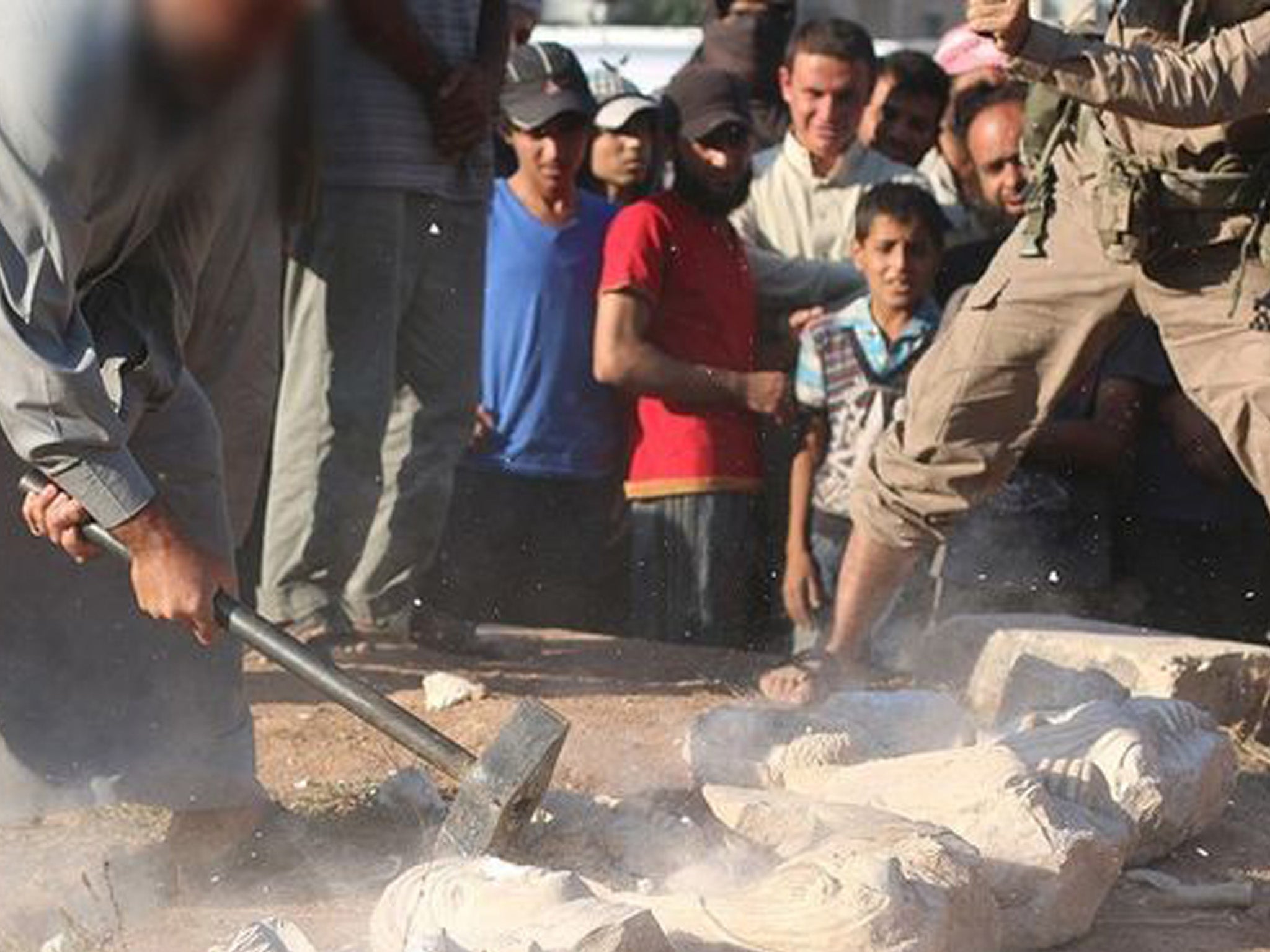 Isis militants destroy statues in the ancient Syrian city of Palmyra