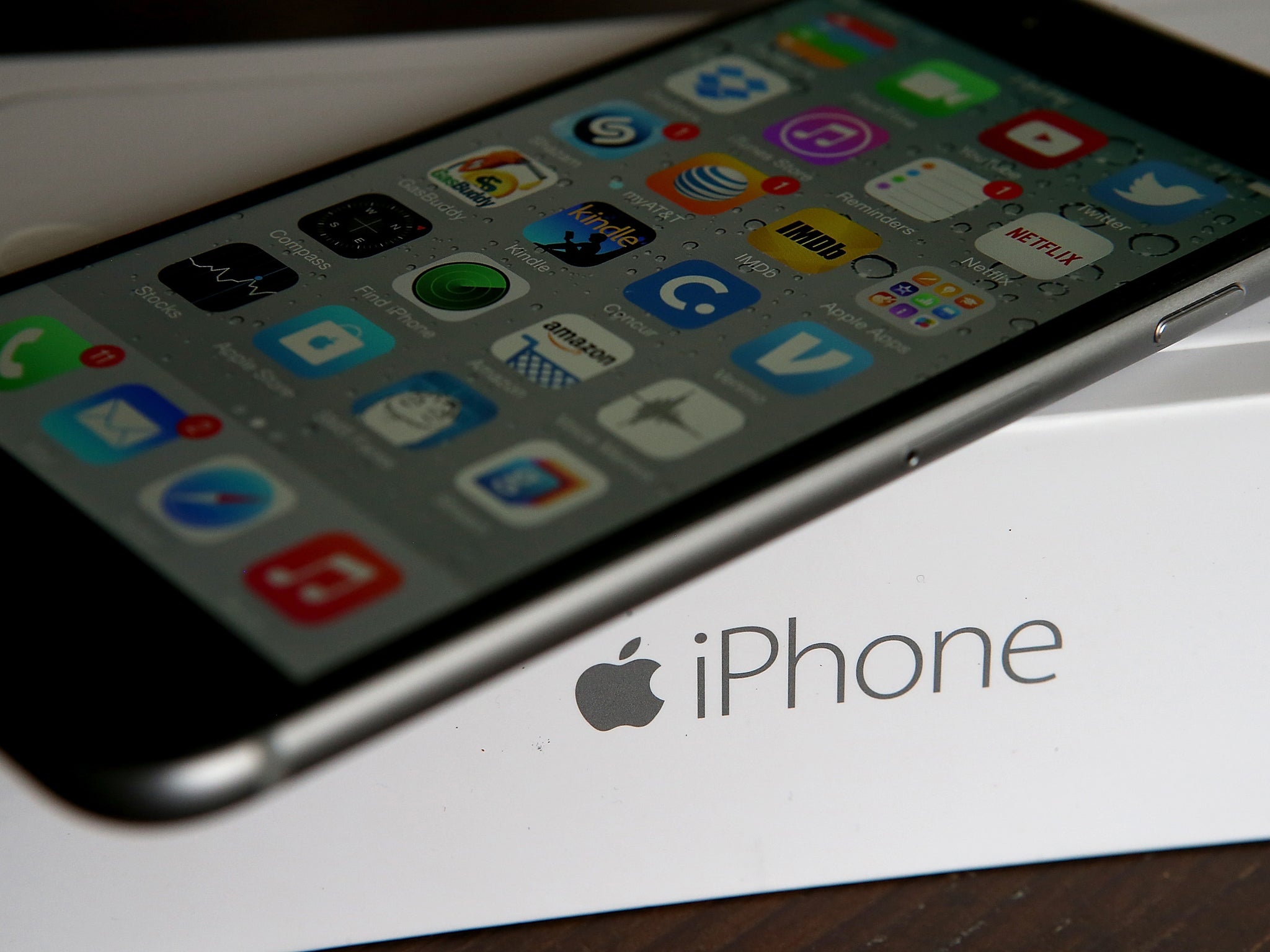 An Apple iPhone sits on a box on January 27, 2015 in San Anselmo, California