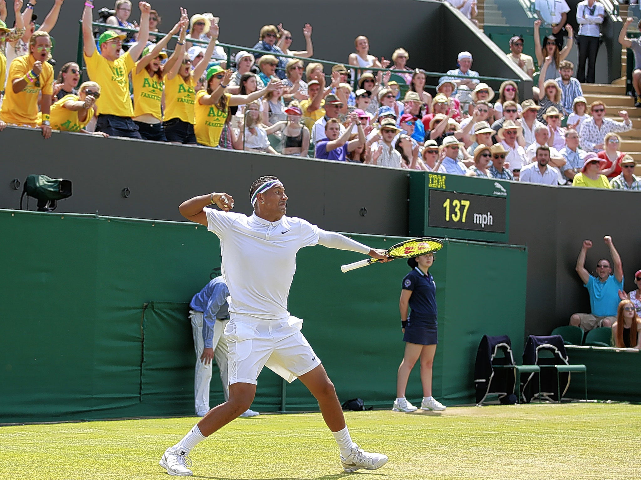 Nick Kyrgios and his yellow T-shirted fan club start to celebrate his victory over Milos Raonic