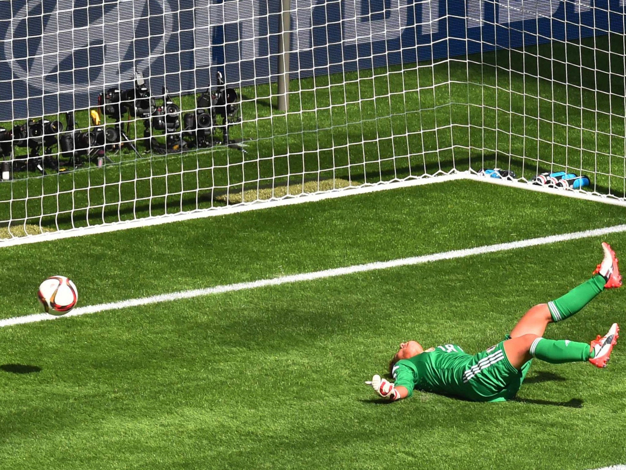 Japanese goalkeeper Kaihori was caught far off her line and could only touch the ball onto the post and into the net