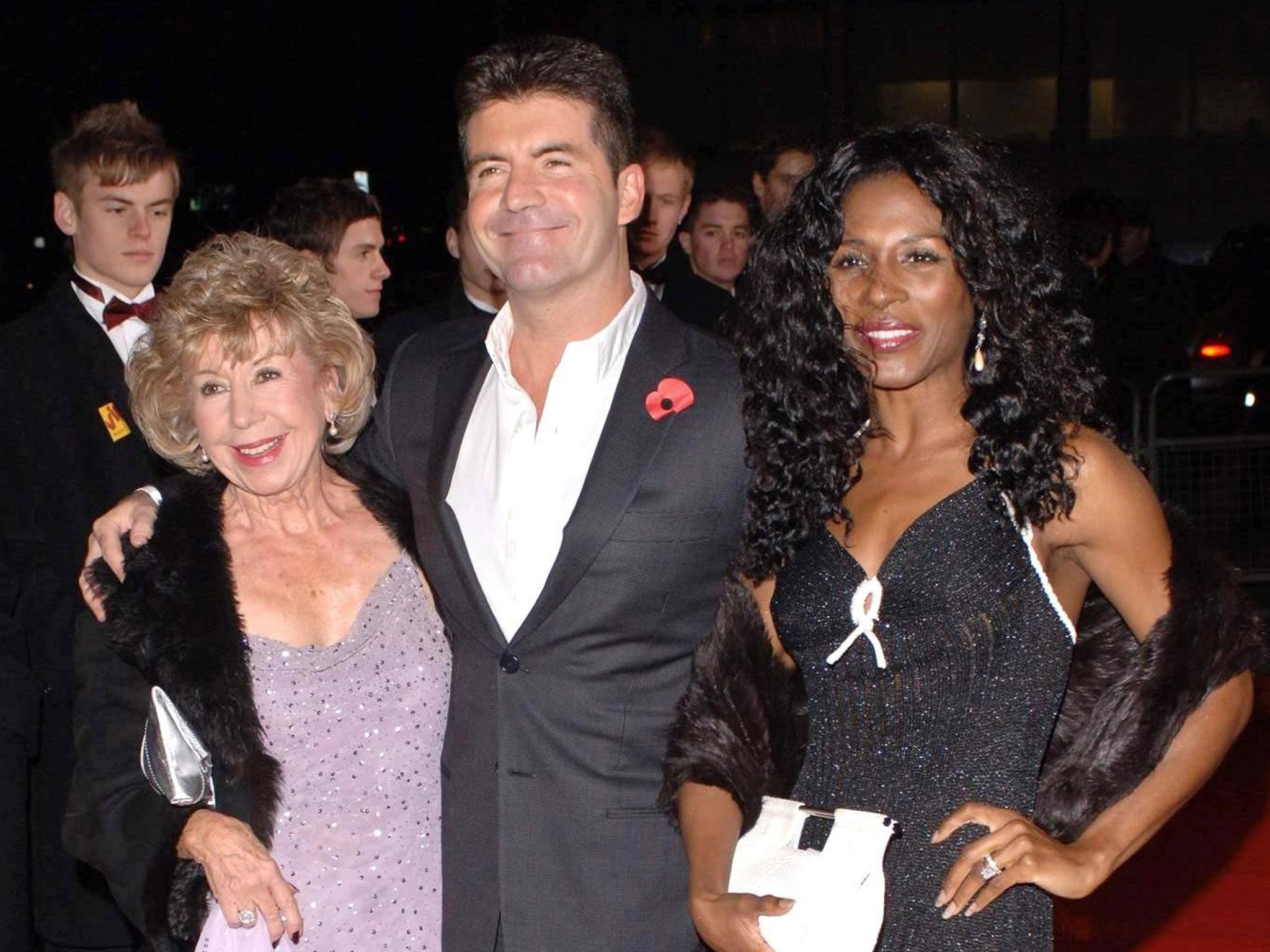 Simon Cowell with his mother, Julie, and Sinitta, as Julie Cowell has died at the age of 89.