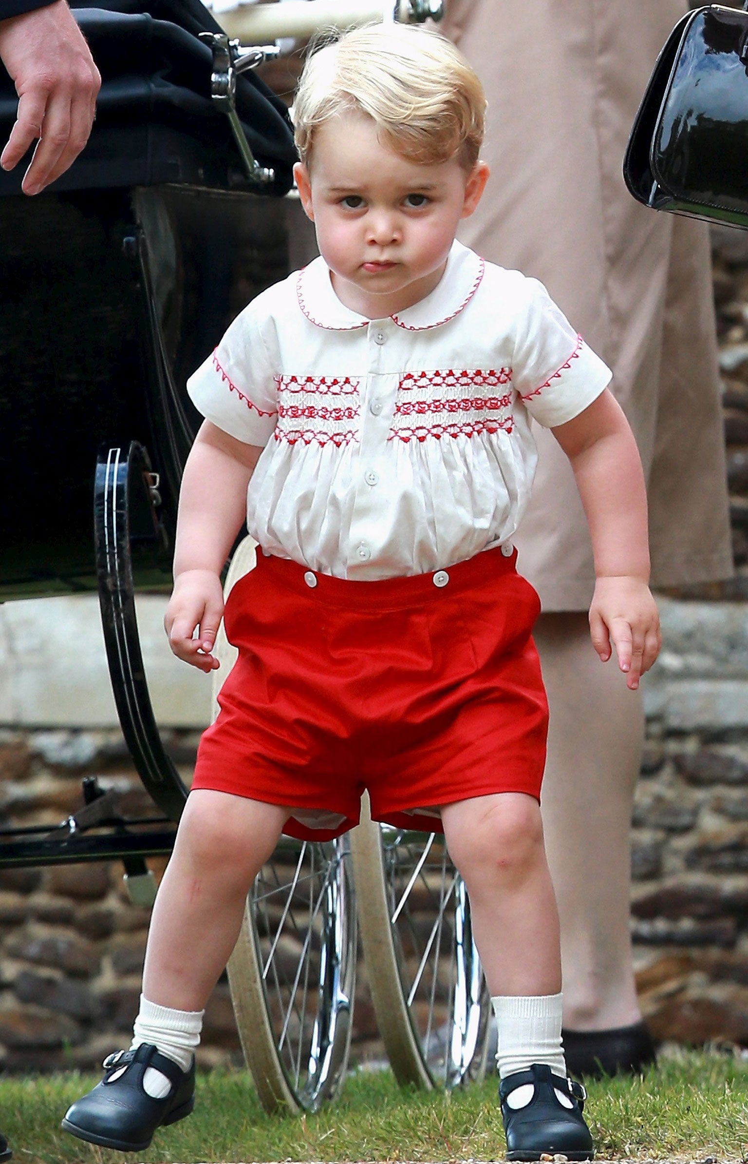 Prince George of Cambridge leaves the Church of St Mary Magdalene on the Sandringham Estate for the Christening of Princess Charlotte of Cambridge in King's Lynn