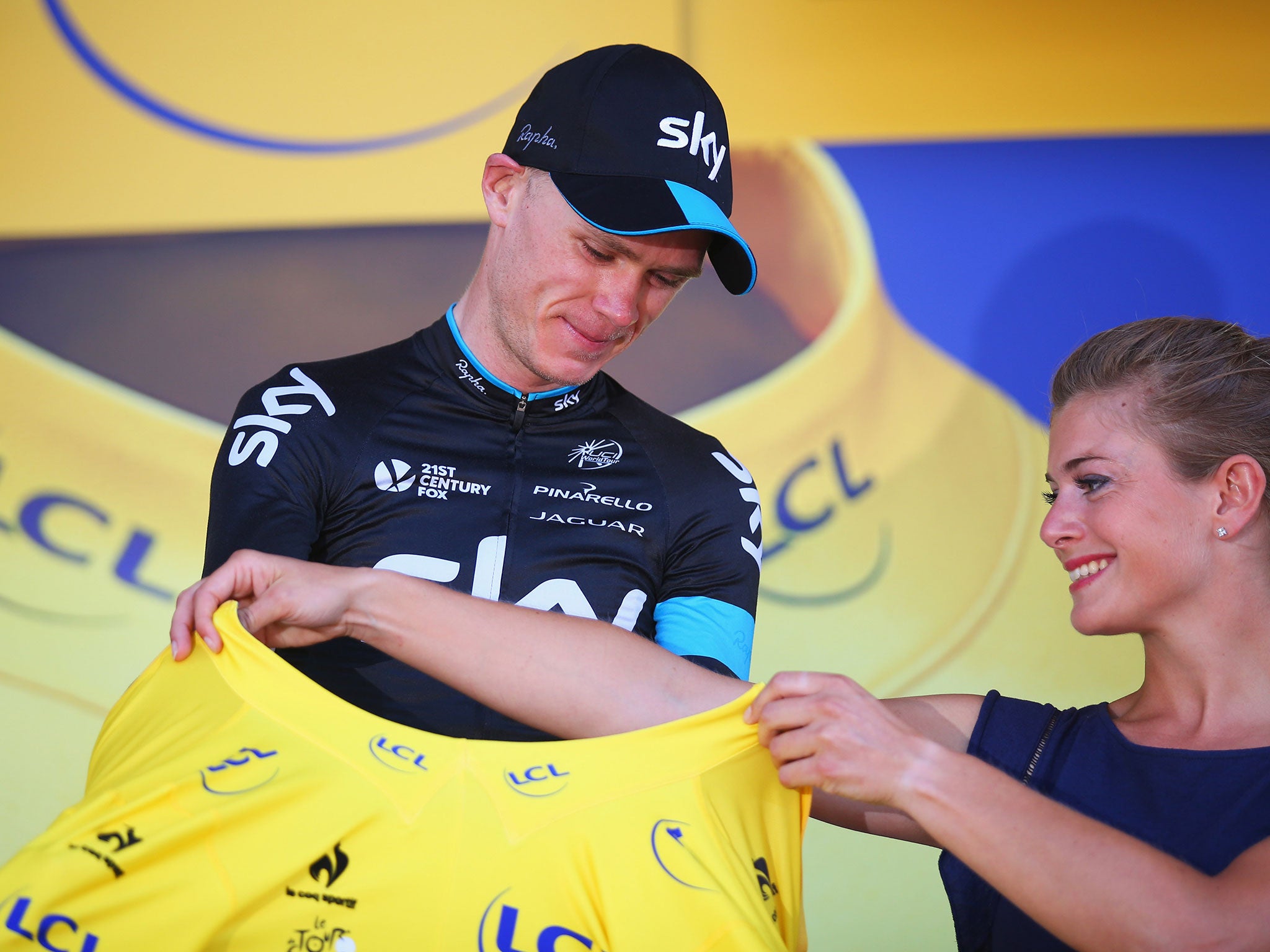 Chris Froome takes the leader's yellow jersey