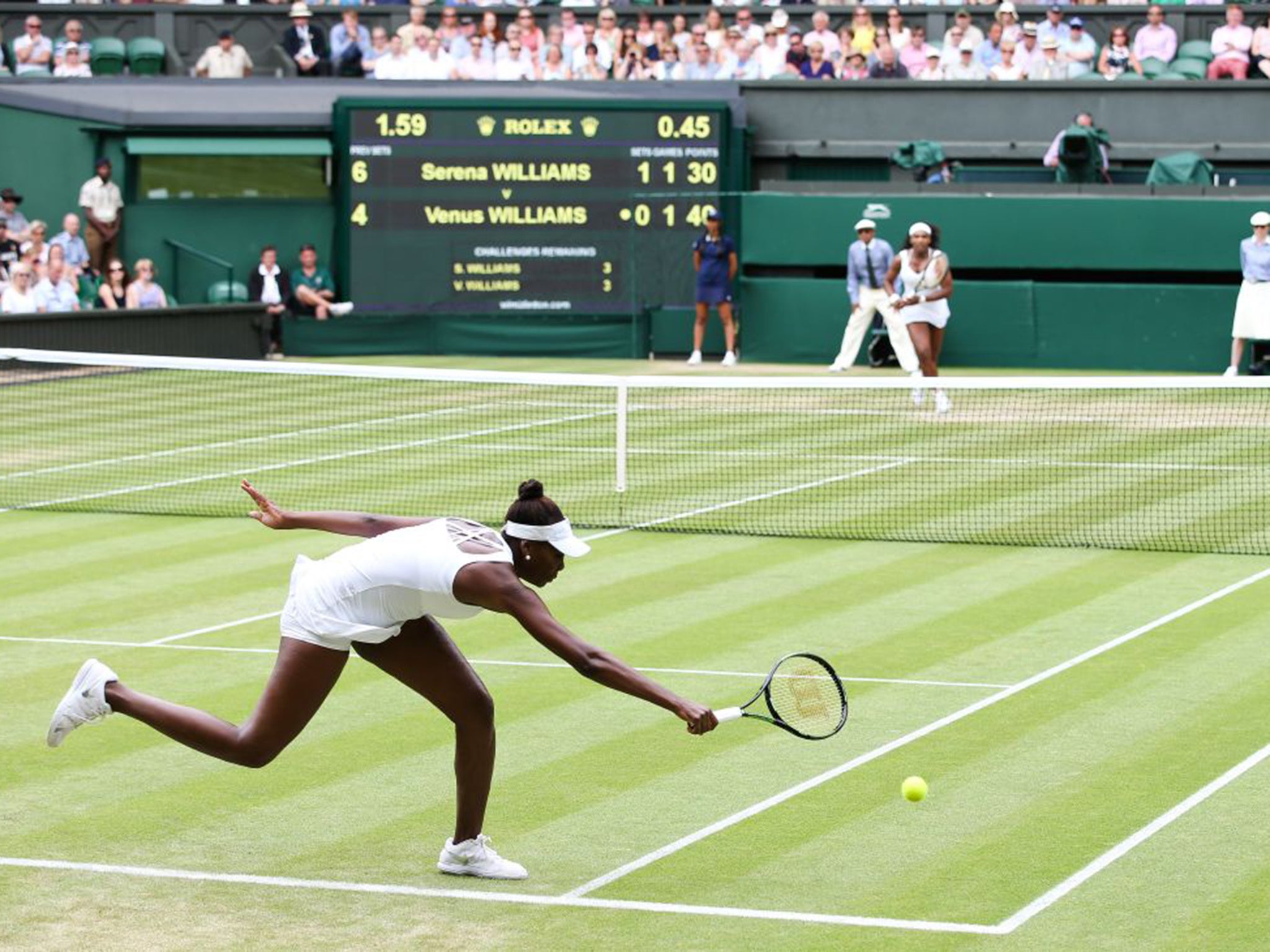 Venus Williams reaches for a shot during her straight-sets defeat to sister Serena