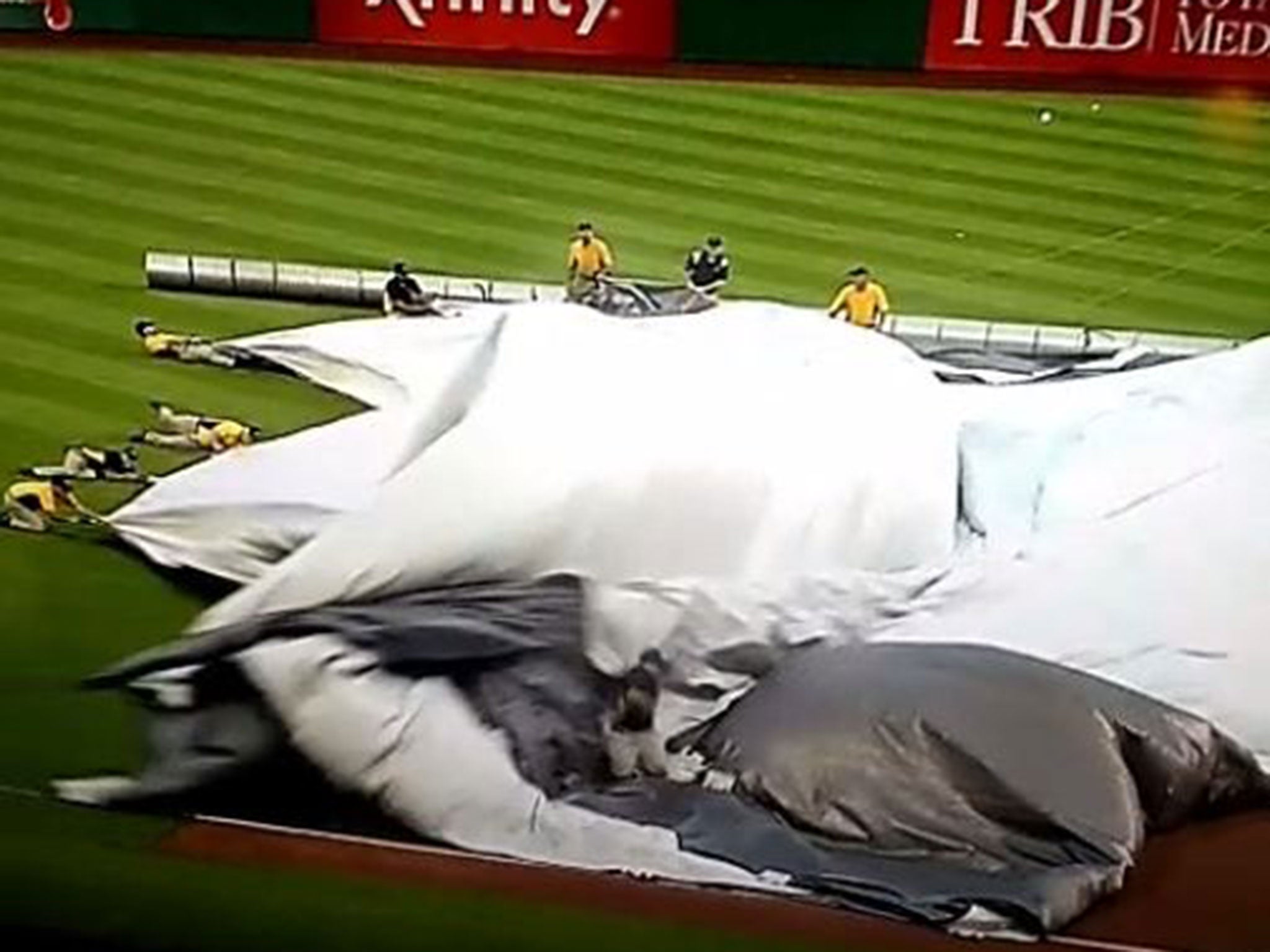 The groundman begins to lose his feet as the sheet begins to rise