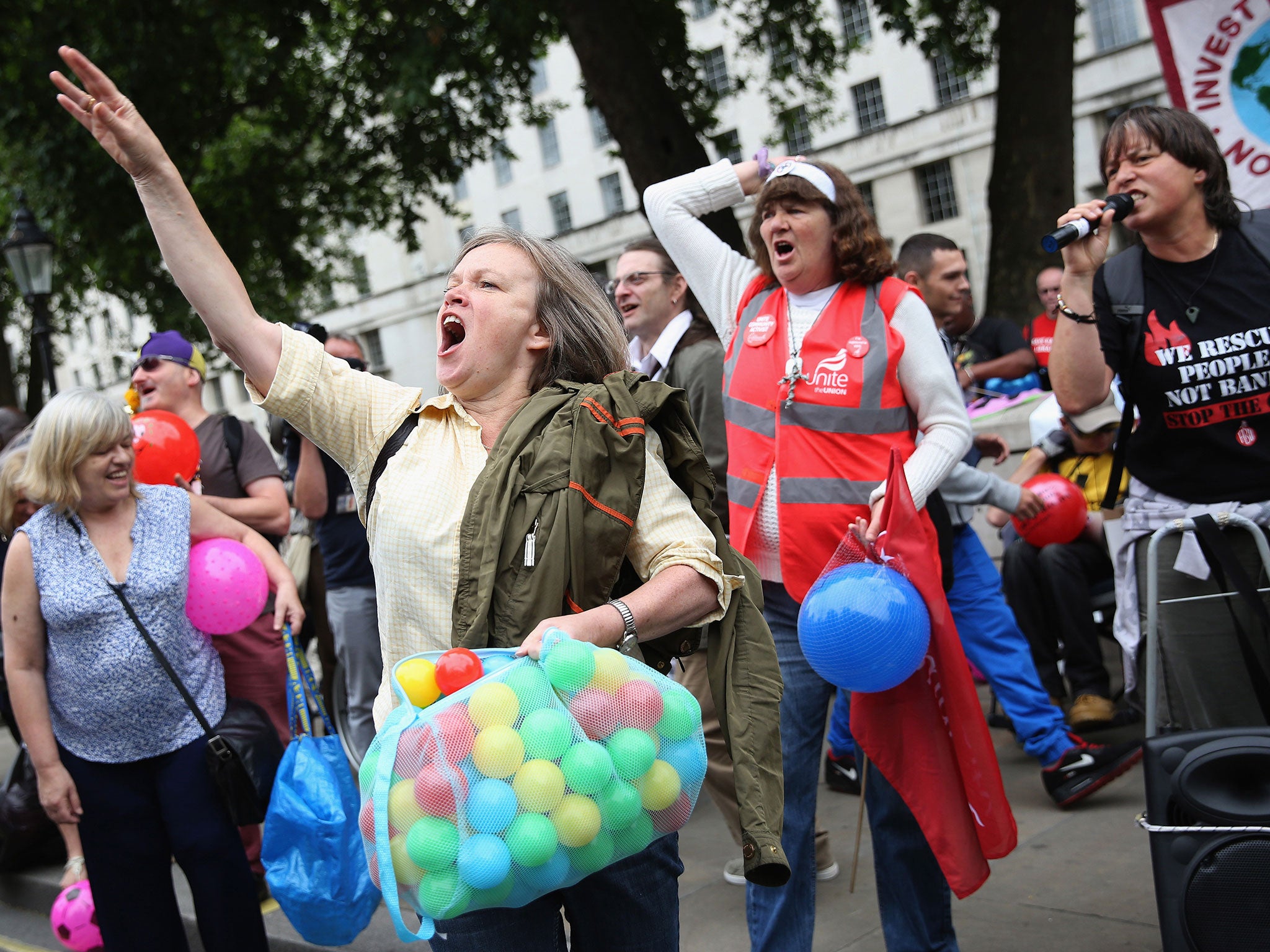 Anti-austerity protesters shout slogans outside Downing Street as the Chancellor of the Exchequer George Osborne left 11 Downing Street