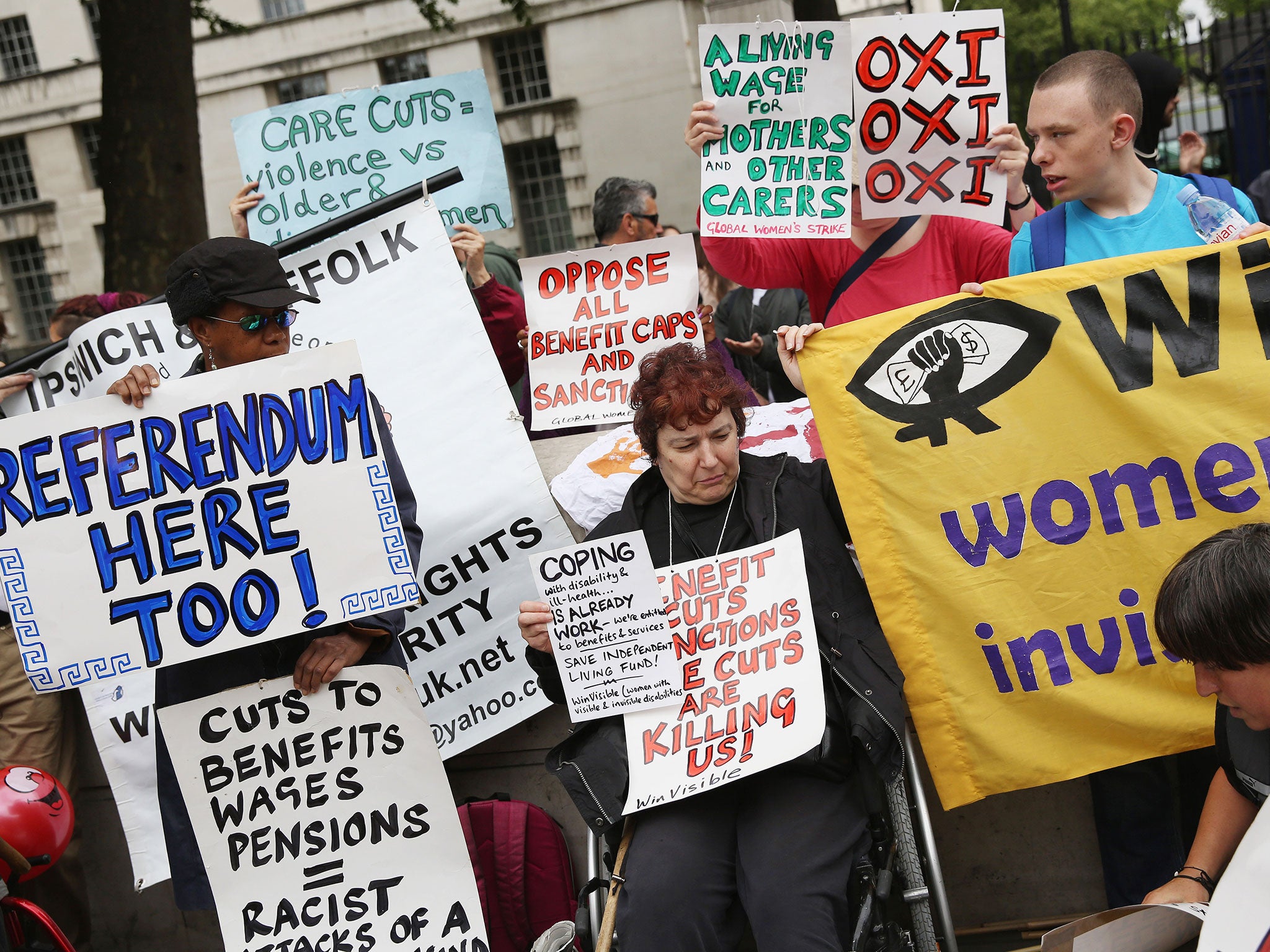 Anti-austerity protesters gather outside Downing Street as the Chancellor of the Exchequer George Osborne left 11 Downing Street in London