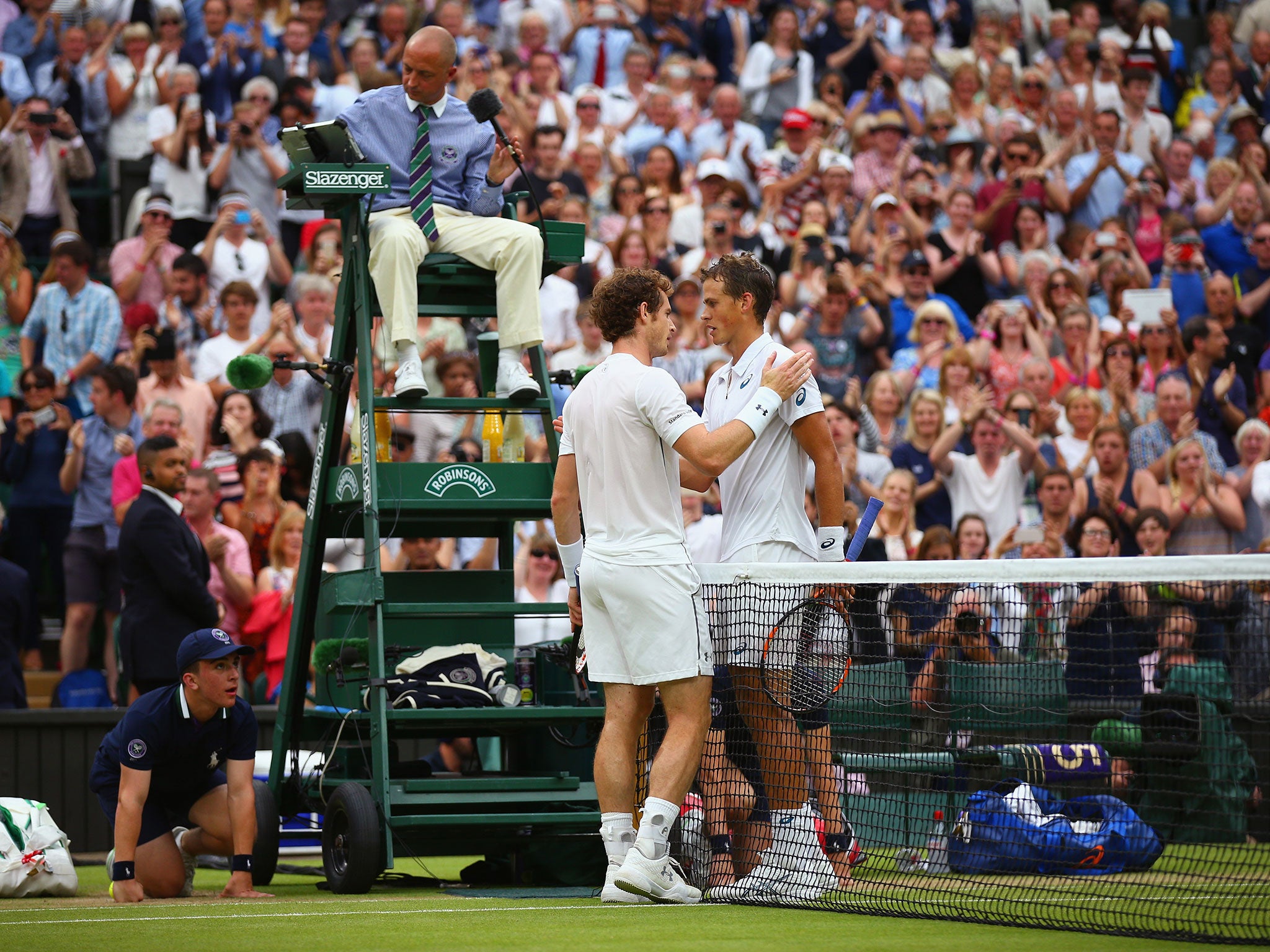 The players embrace after the match