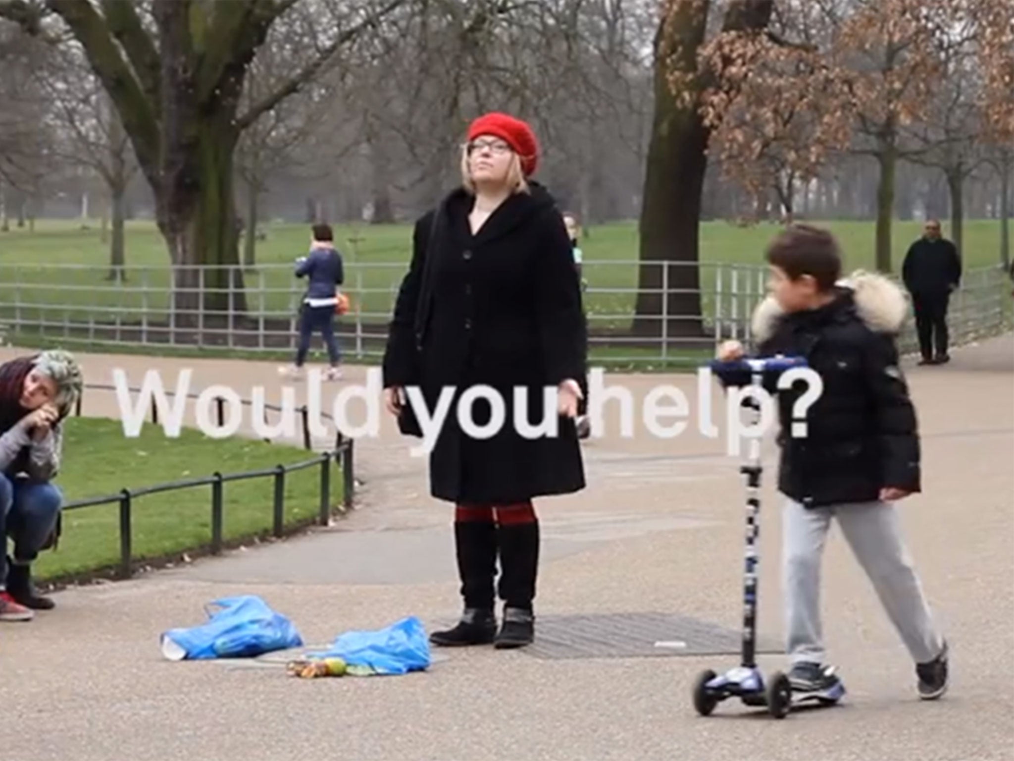 A woman splits her bag in a London park