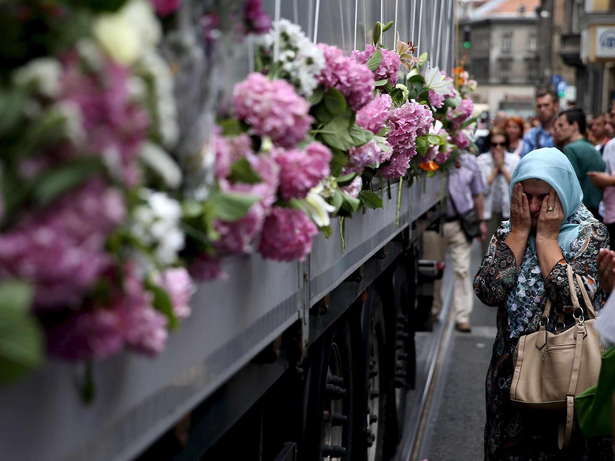 A truck carries Srebrenica victims through Sarajevo