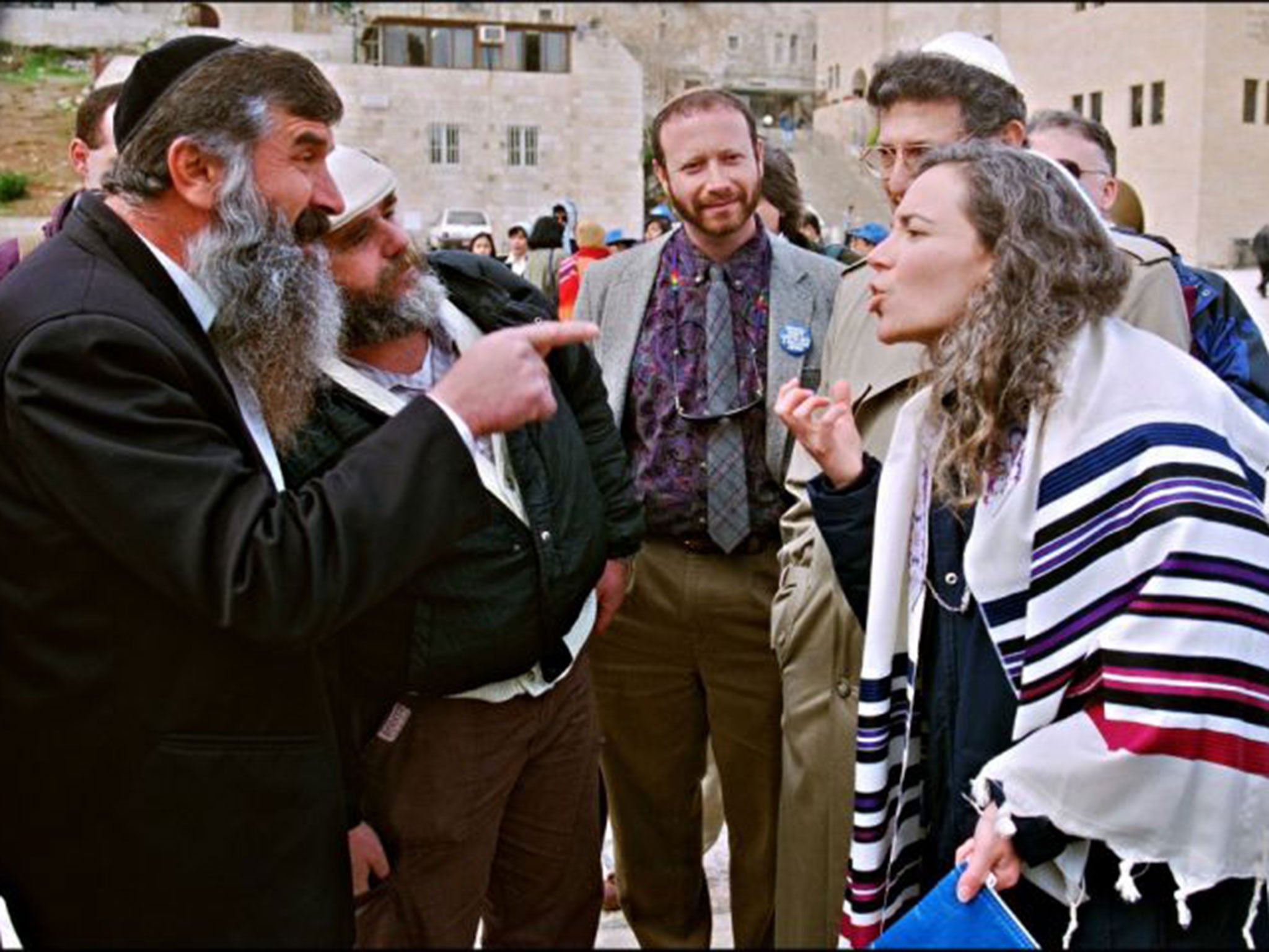 A Jewish woman from the Reform movement argues with ultra-orthodox Jews at the Wailing Wall in Jerusalem's Old City