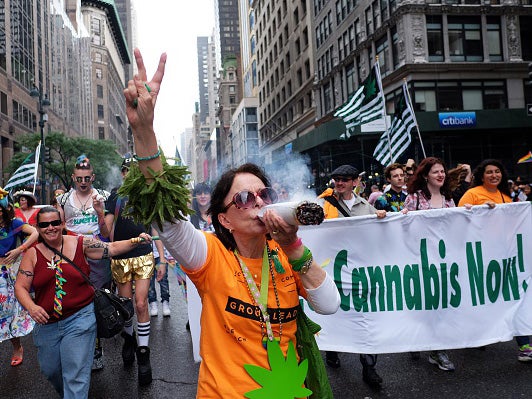 A woman marches in support of the legalisation of cannabis on in New York