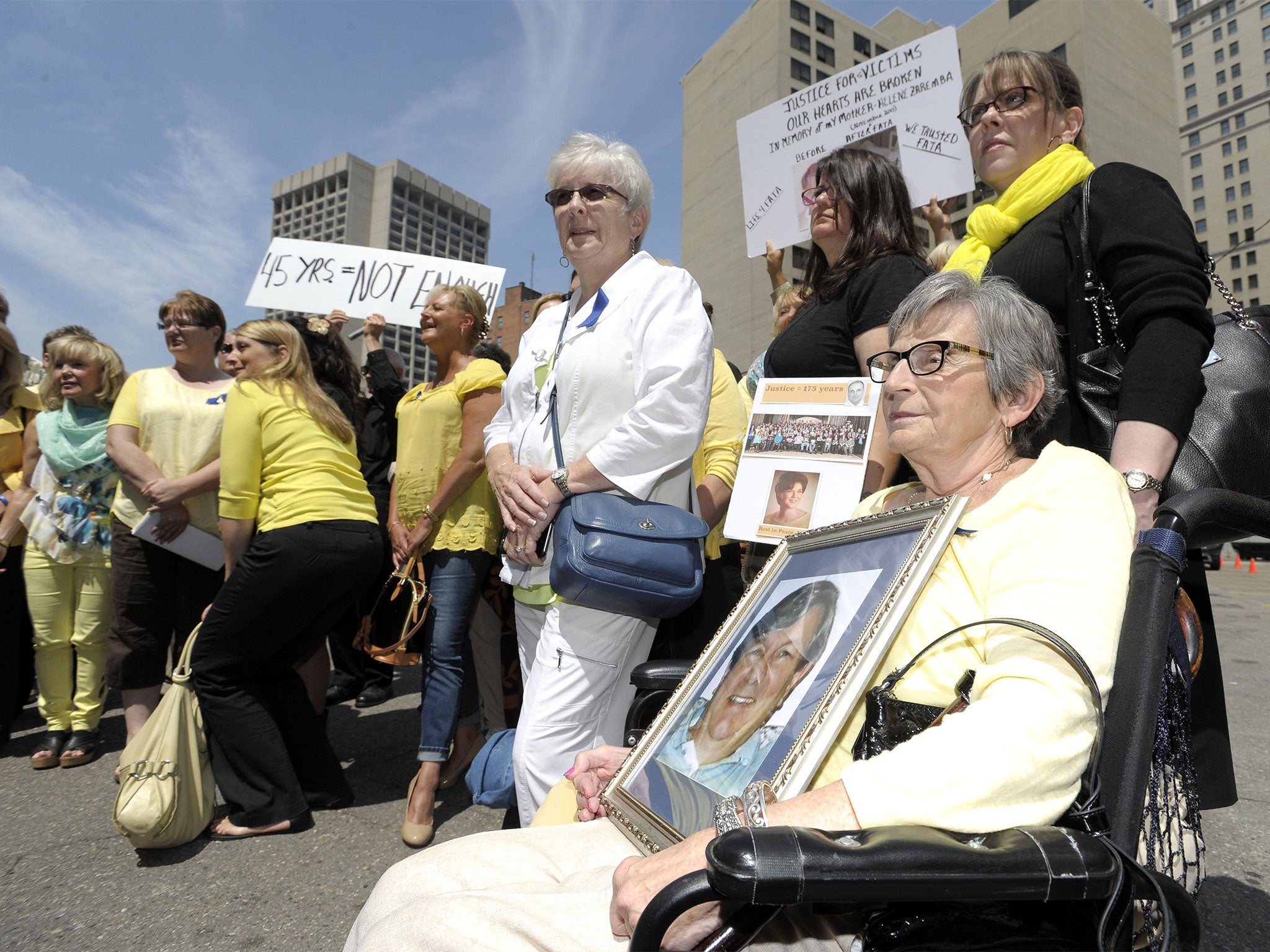 Dr Fata's victims and their family members leave the court house after his sentencing