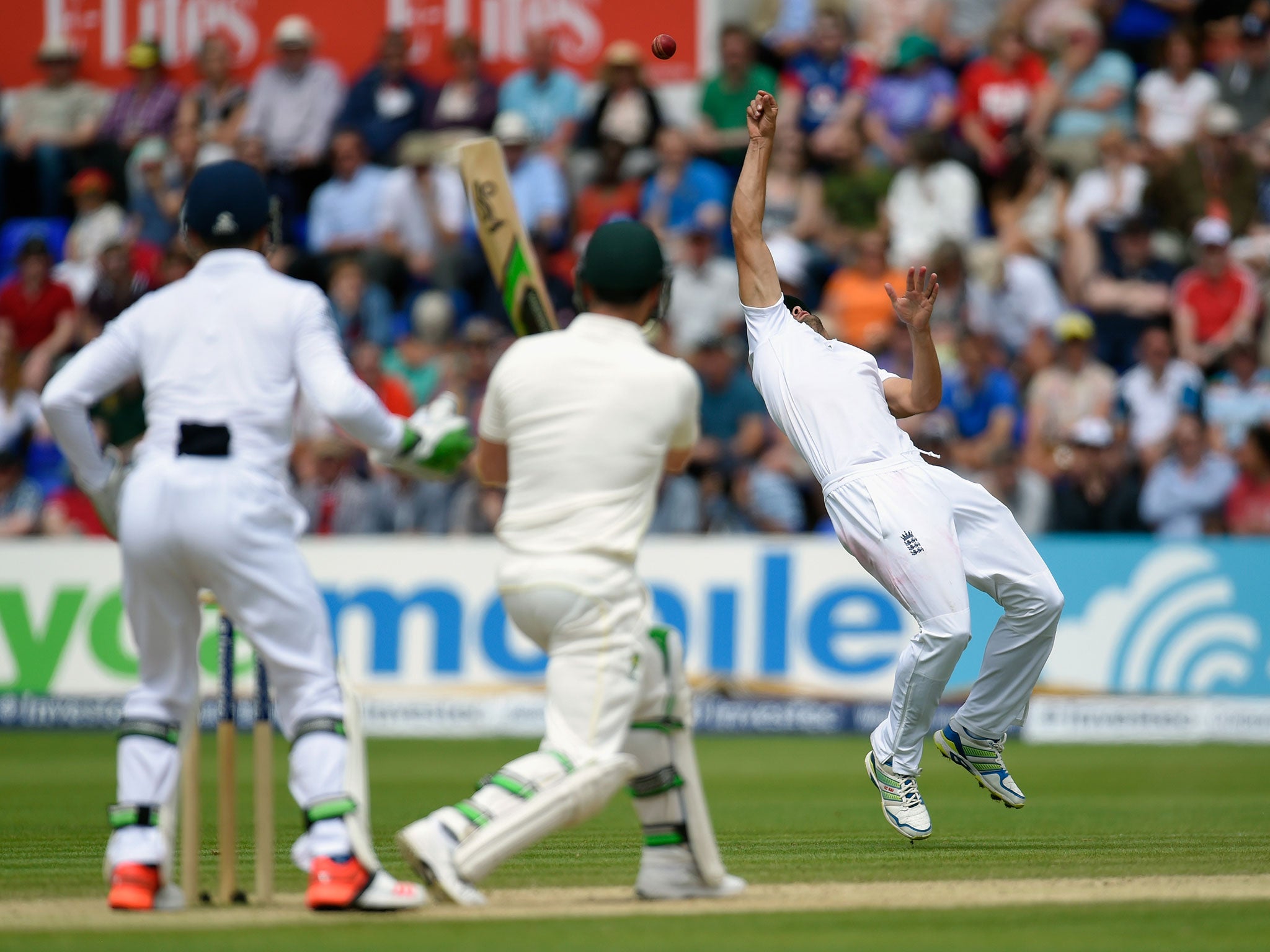 Alastair Cook palms the ball up into the air