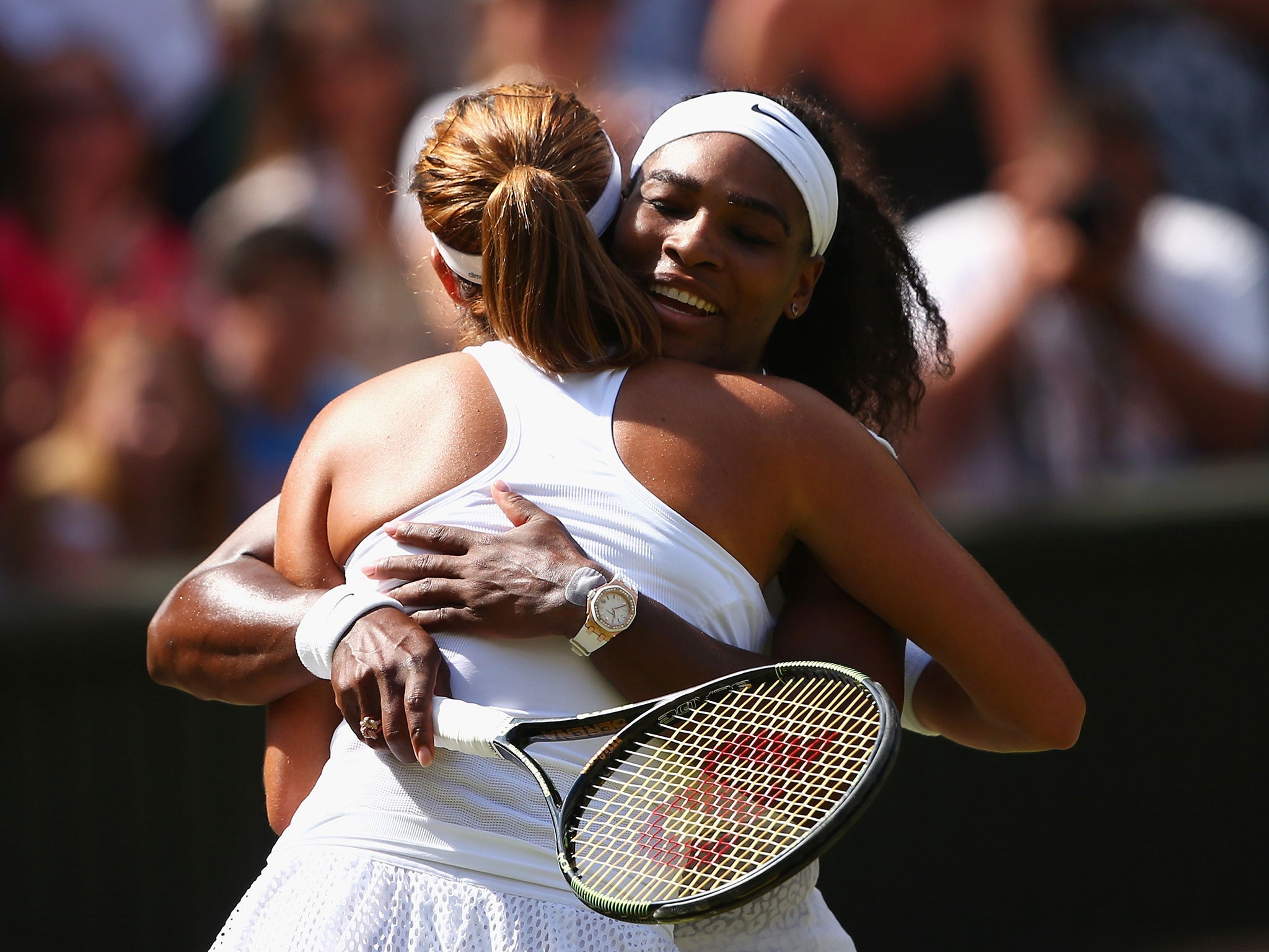 Muguruza and Williams embrace after their Wimbledon final