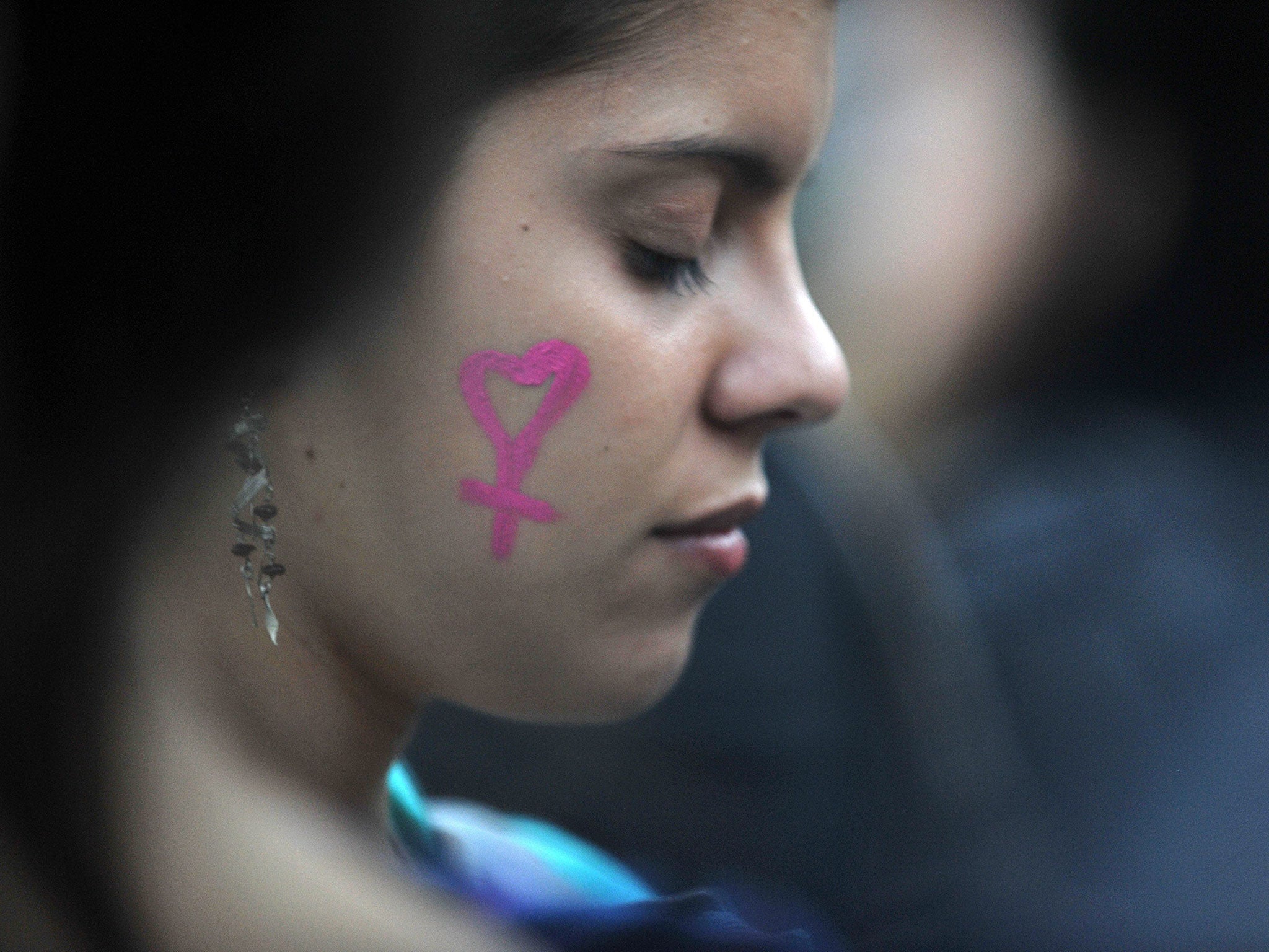 An Argentinean woman takes part in a demonstration to raise awareness of 'femicide' in the country, and to demand the implementation of the law against gender violence