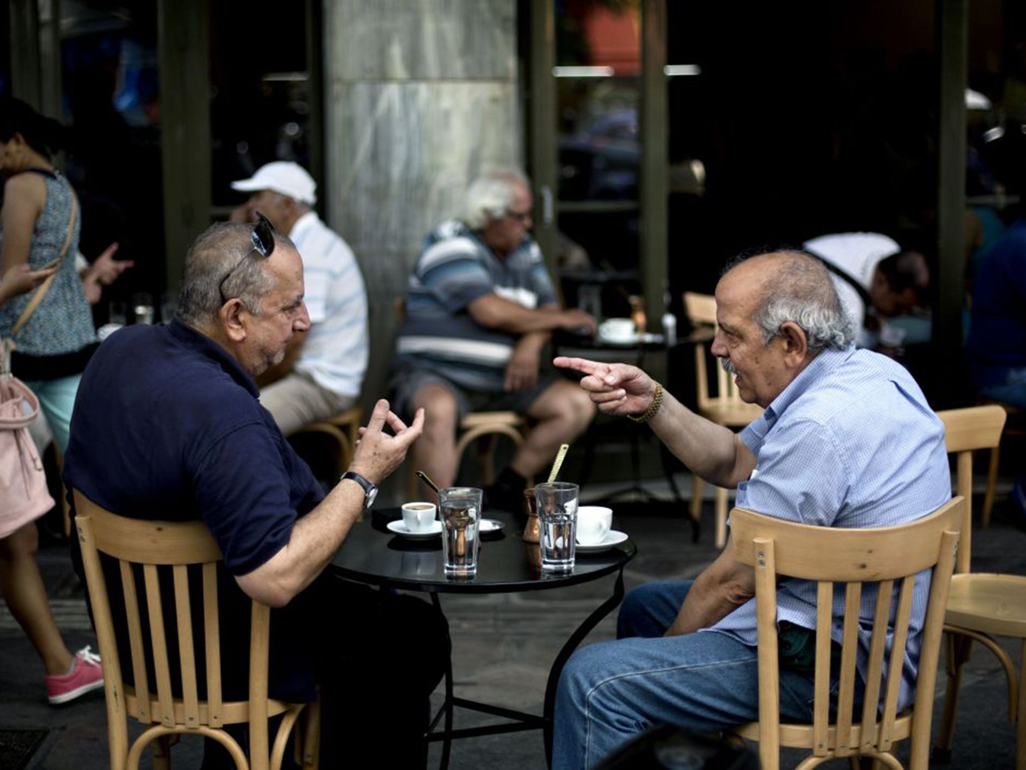 In bars and cafés, German Chancellor Angela Merkel and her finance minister Wolfgang Schäuble pop up often in conversation