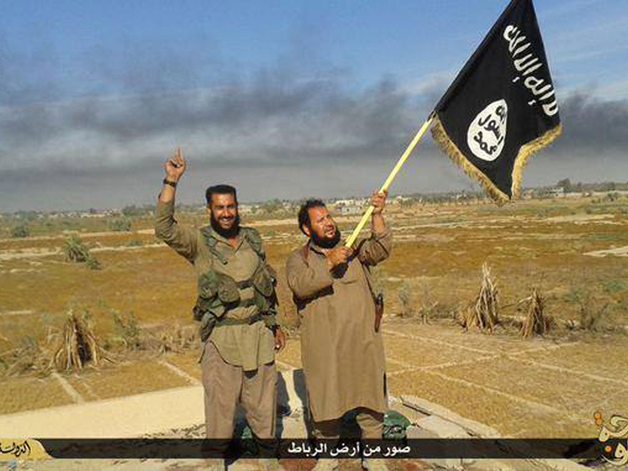 Isis fighters celebrating in Fallujah, which the militants took in 2014