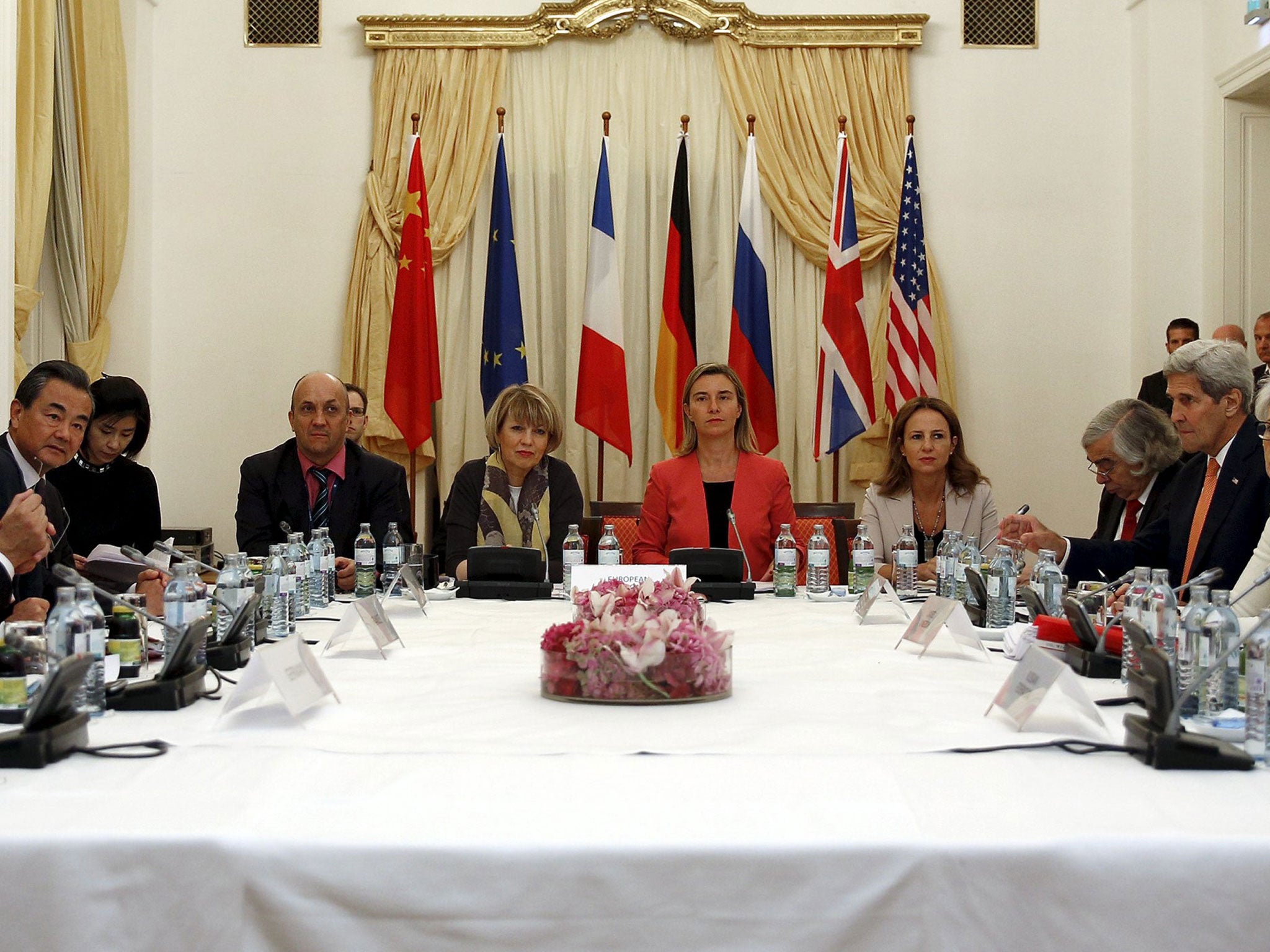 Chinese Foreign Minister Wang Yi, far left, at Iranian nuclear talks. Also present at the hotel in Vienna were European Union foreign policy chief Federica Mogherini, centre, in red, and US Secretary of State John Kerry, far right