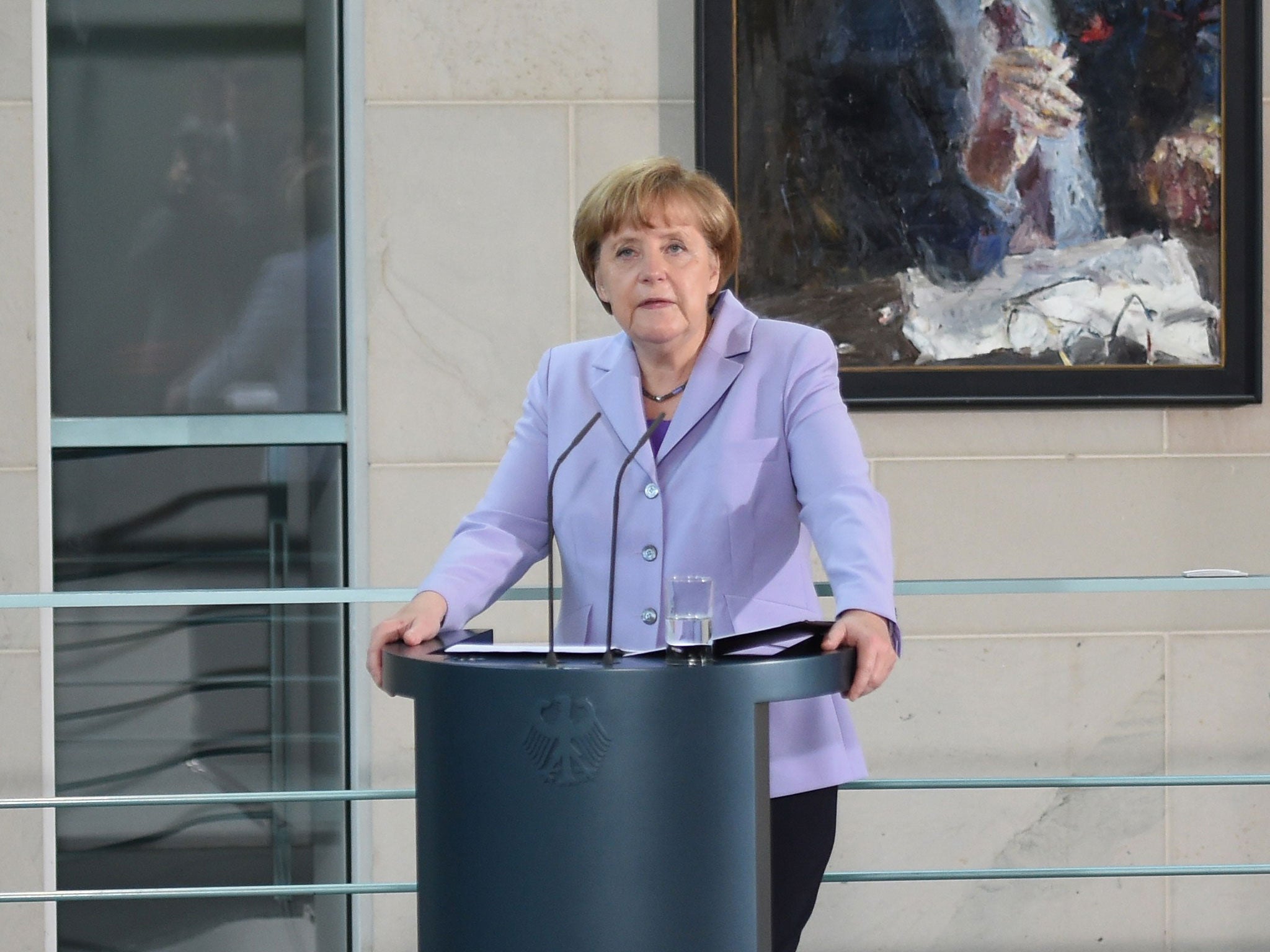 Chancellor Angela Merkel joined other eurozone leaders in giving her wholehearted backing to last-minute breakthrough deal with Greece and declared she supported the outcome with 'complete conviction'