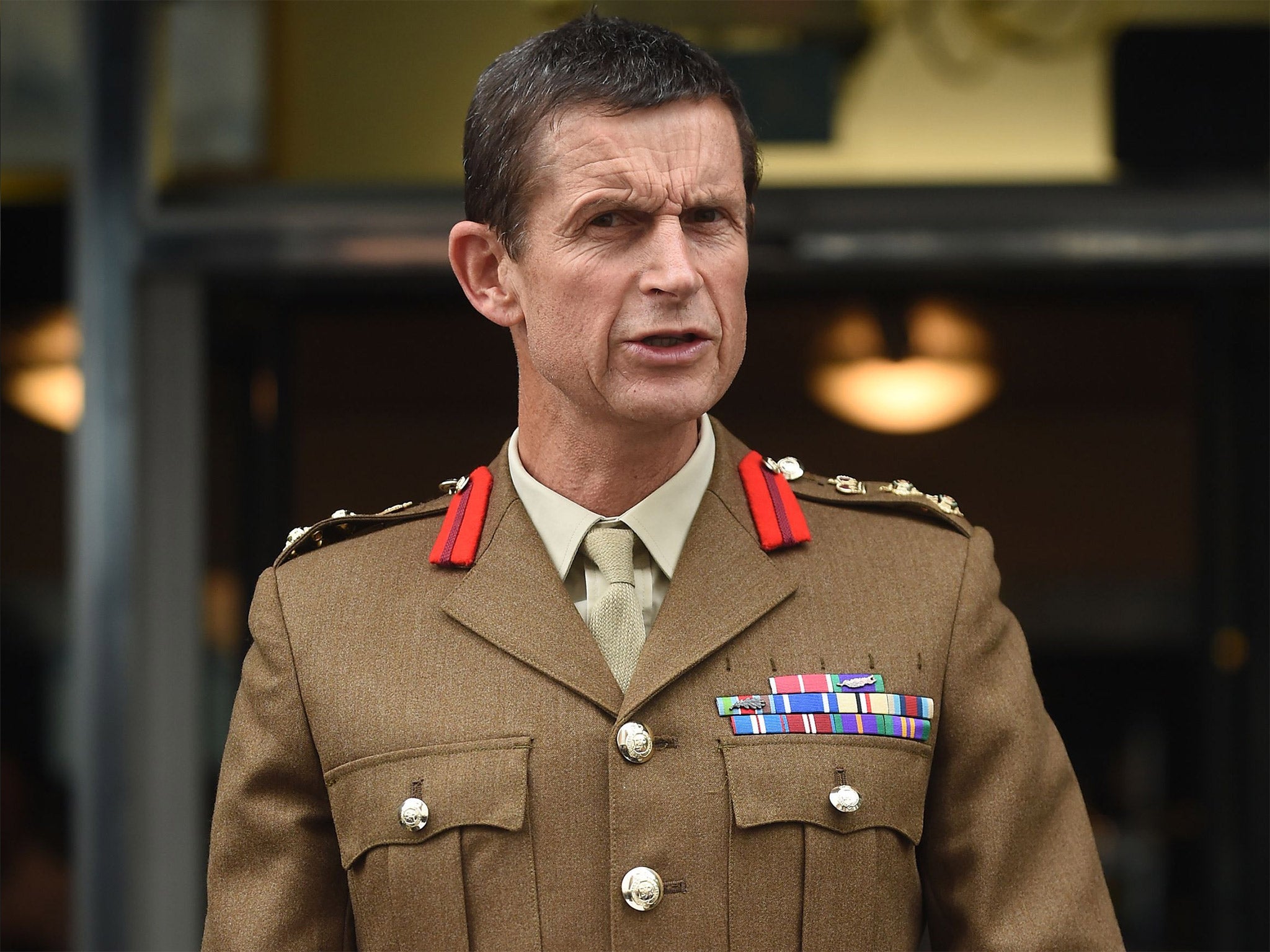 Brigadier John Donnelly, director of personal services at the Ministry of Defence, reads a statement outside the Civic Suite in Solihull