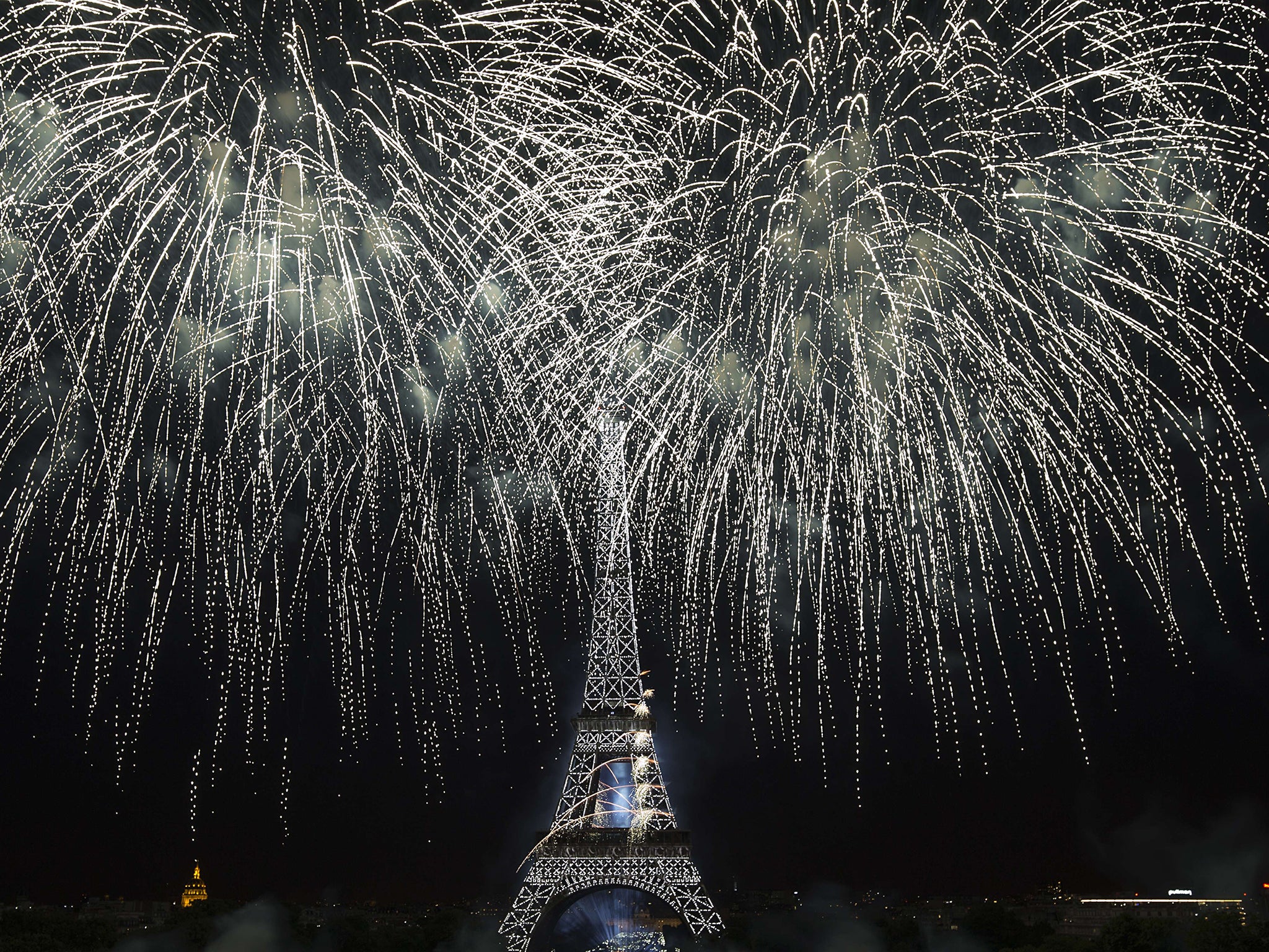 Fireworks light the skies above the Eiffel Tower