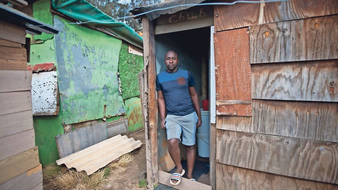 Mr Molewa outside the home he has desperately wanted to get get out of for the past eight years