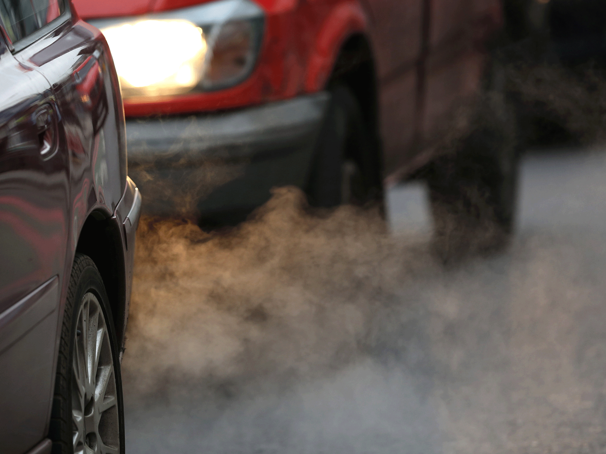 Exhaust fumes from a car in Putney High Street in 2013 (Getty)